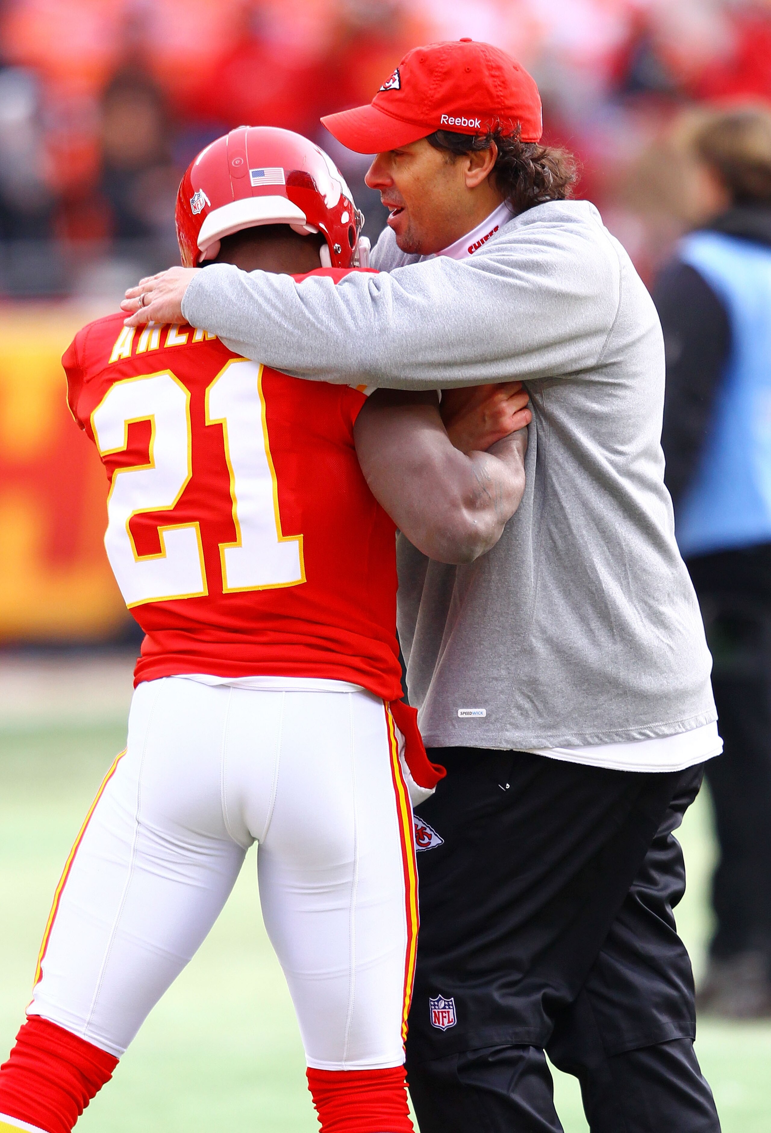 KANSAS CITY, MO - JANUARY 09: Head coach Todd Haley of the Kansas City Chiefs hugs cornerback Javier Arenas #21 prior to the 2011 AFC wild card playoff game against the Baltimore Ravens at Arrowhead Stadium on January 9, 2011 in Kansas City, Missouri. ( KANSAS CITY, MO - JANUARY 09: Head coach Todd Haley of the Kansas City Chiefs hugs cornerback Javier Arenas #21 prior to the 2011 AFC wild card playoff game against the Baltimore Ravens at Arrowhead Stadium on January 9, 2011 in Kansas City, Missouri. (