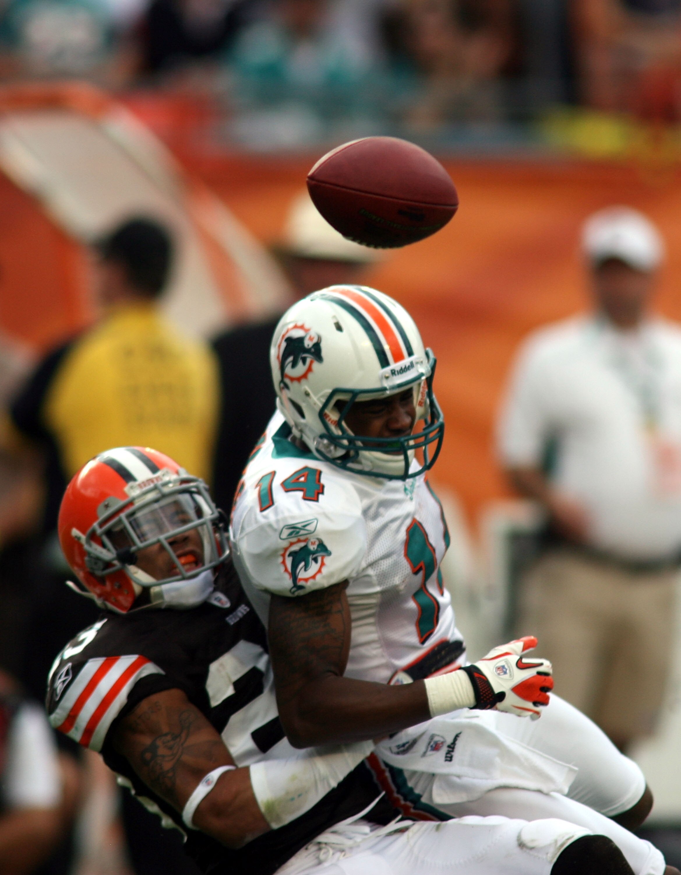 MIAMI - DECEMBER 05:  Receiver Marlon Moore #14  of the Miami Dolphins is defended by Sheldon Brown #24 of the Cleveland Browns at Sun Life Stadium on December 5, 2010 in Miami, Florida.  (Photo by Marc Serota/Getty Images)
