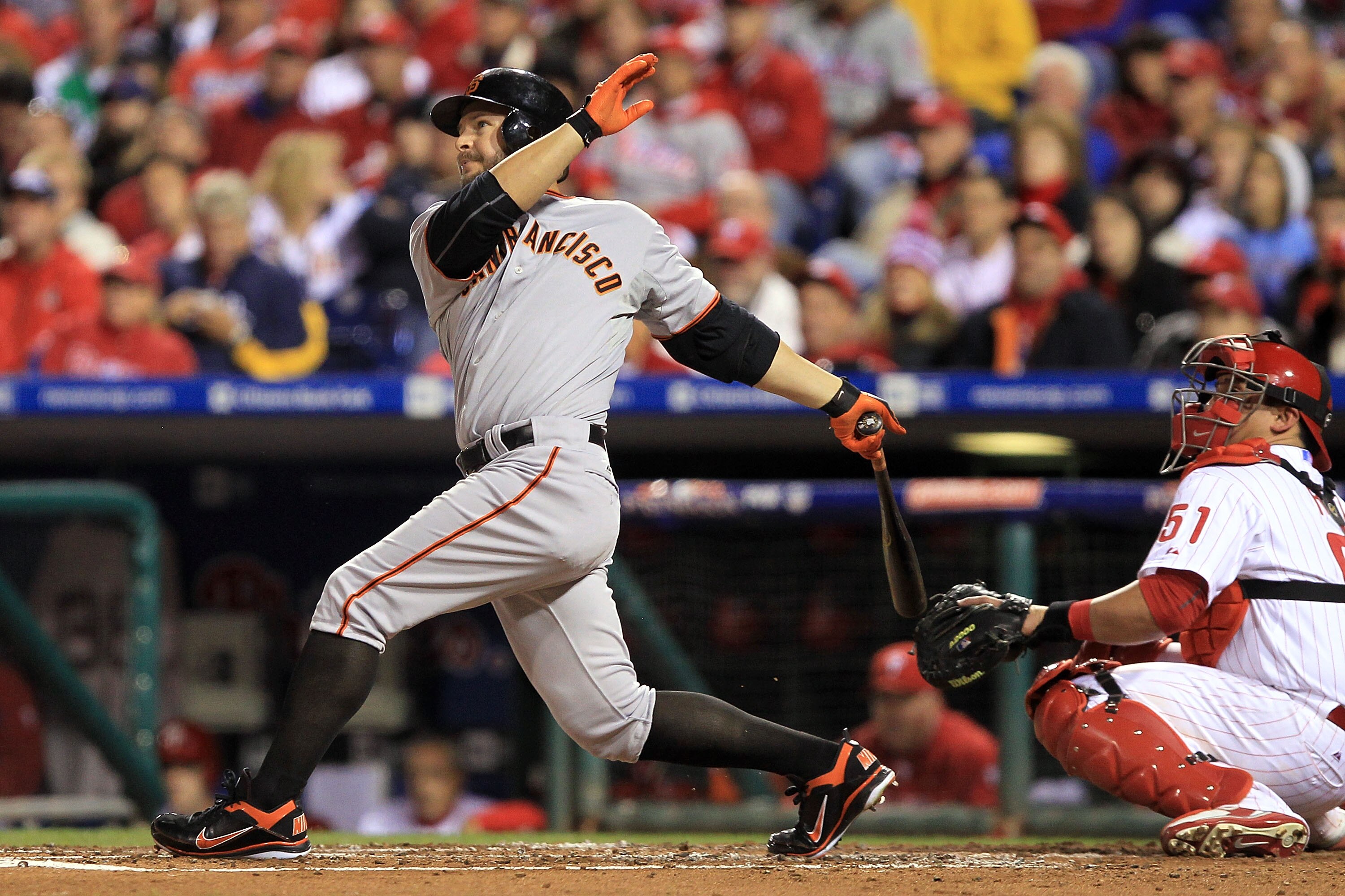 PHILADELPHIA - OCTOBER 16:  Cody Ross #13 of the San Francisco Giants hits a homerun against the Philadelphia Phillies in the third inning of Game One of the NLCS during the 2010 MLB Playoffs at Citizens Bank Park on October 16, 2010 in Philadelphia, Penn