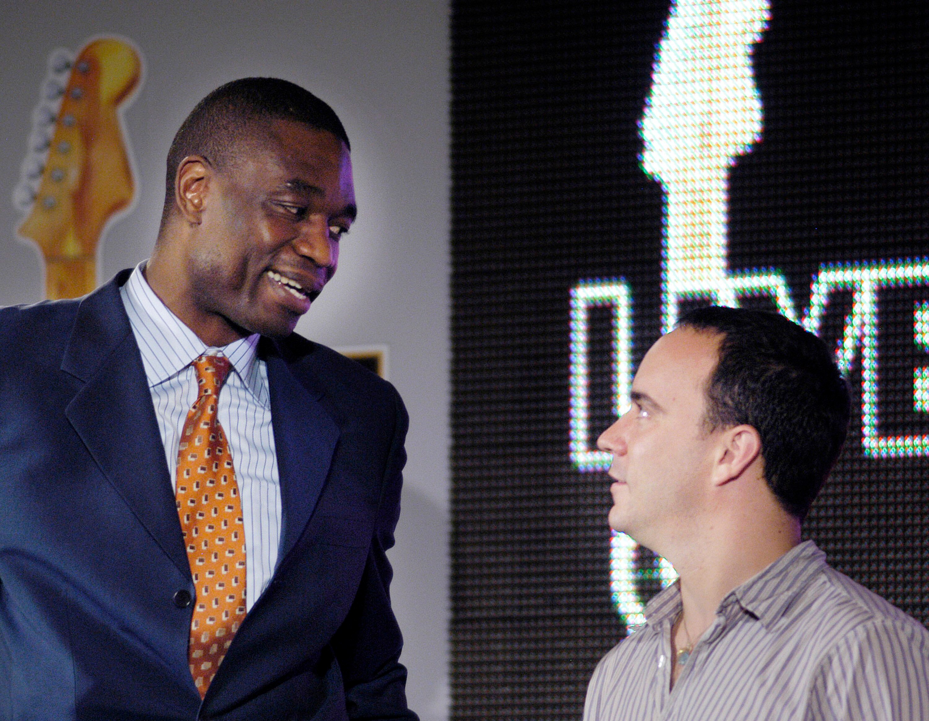 PHILADELPHIA - MAY 31:  Dikembe Mutumbo (L) speaks with musician Dave Matthews during a news conference to announce the upcoming Live Eight concert to raise money to aid Africa May 31, 2005 in Philadelphia, Pennsylvania. The July 2, 2005 event, to be held