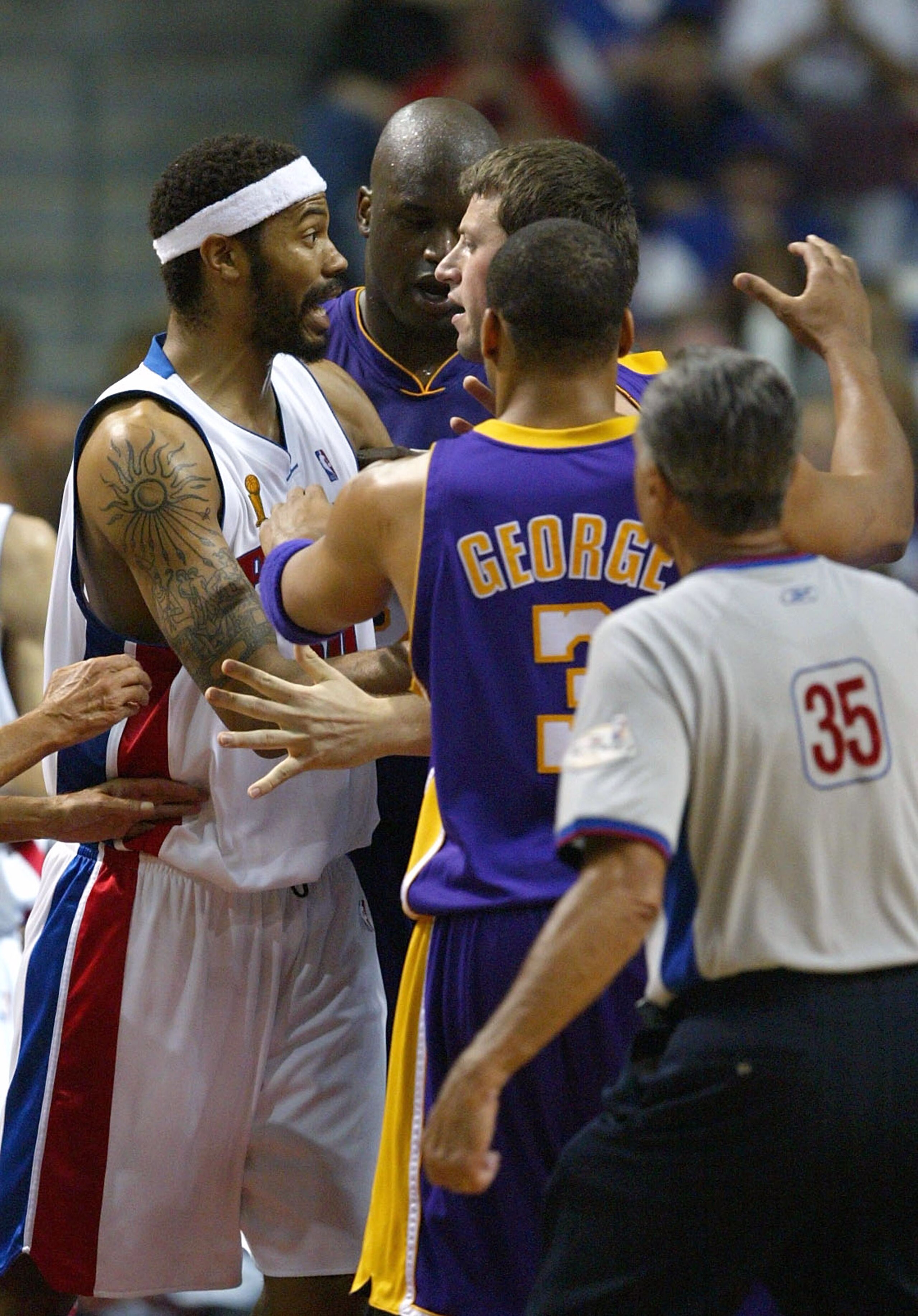 AUBURN HILLS, MI - JUNE 13: Rasheed Wallace #30 of the Detroit Pistons and Slava Medvedenko #14 the Los Angeles Lakers receive double technical fouls for their confrontation in the third quarter of game four of the 2004 NBA Finals on June 13, 2004 at The AUBURN HILLS, MI - JUNE 13: Rasheed Wallace #30 of the Detroit Pistons and Slava Medvedenko #14 the Los Angeles Lakers receive double technical fouls for their confrontation in the third quarter of game four of the 2004 NBA Finals on June 13, 2004 at The