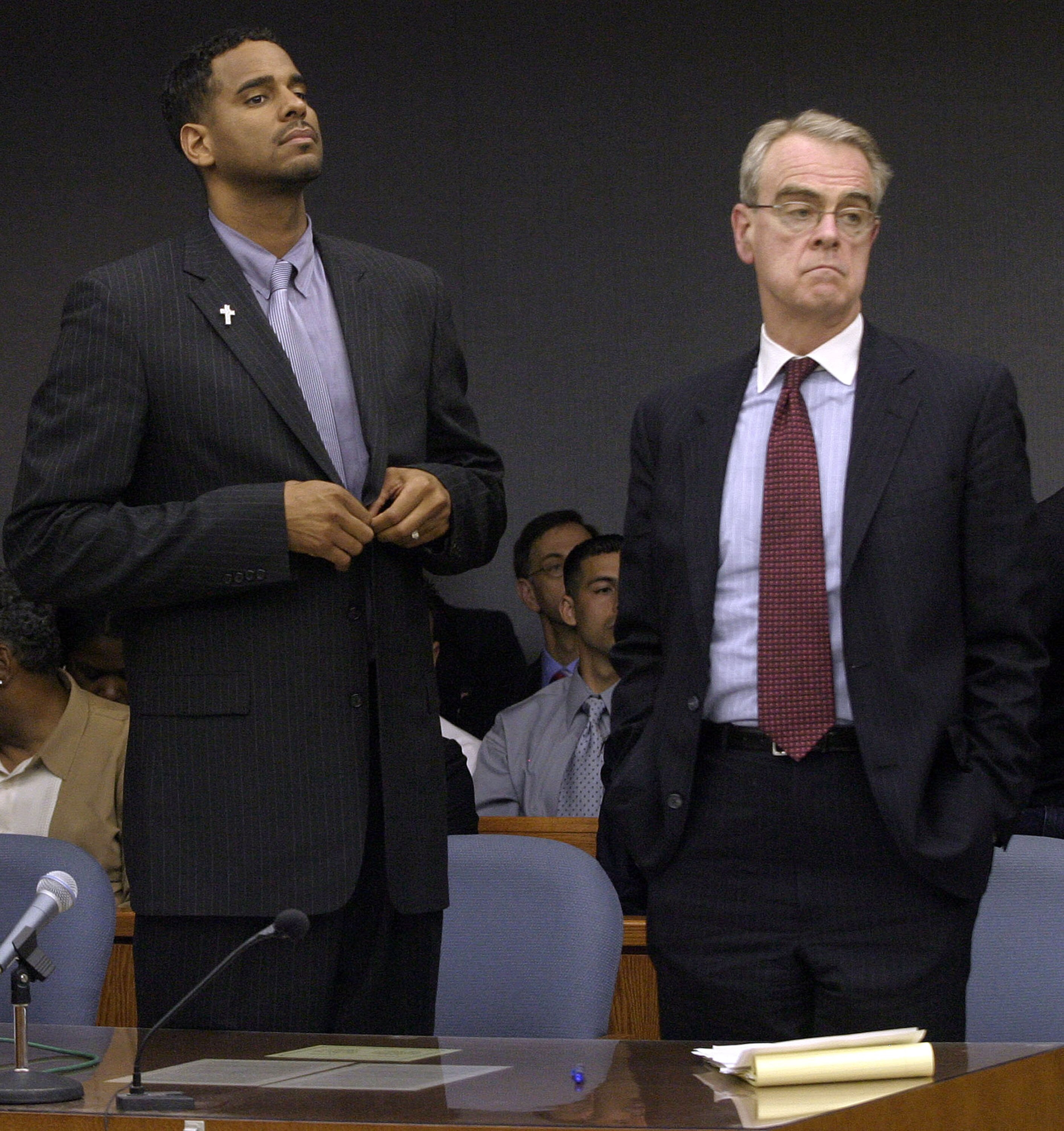 SOMERVILLE, NJ - APRIL 29:  Former NBA star Jayson Williams (L) stands with one of his defense attorneys Joseph Hayden as the jurors leave the courtroom during the third day of jury deliberations during Williams' manslaughter trial at the Somerset County 