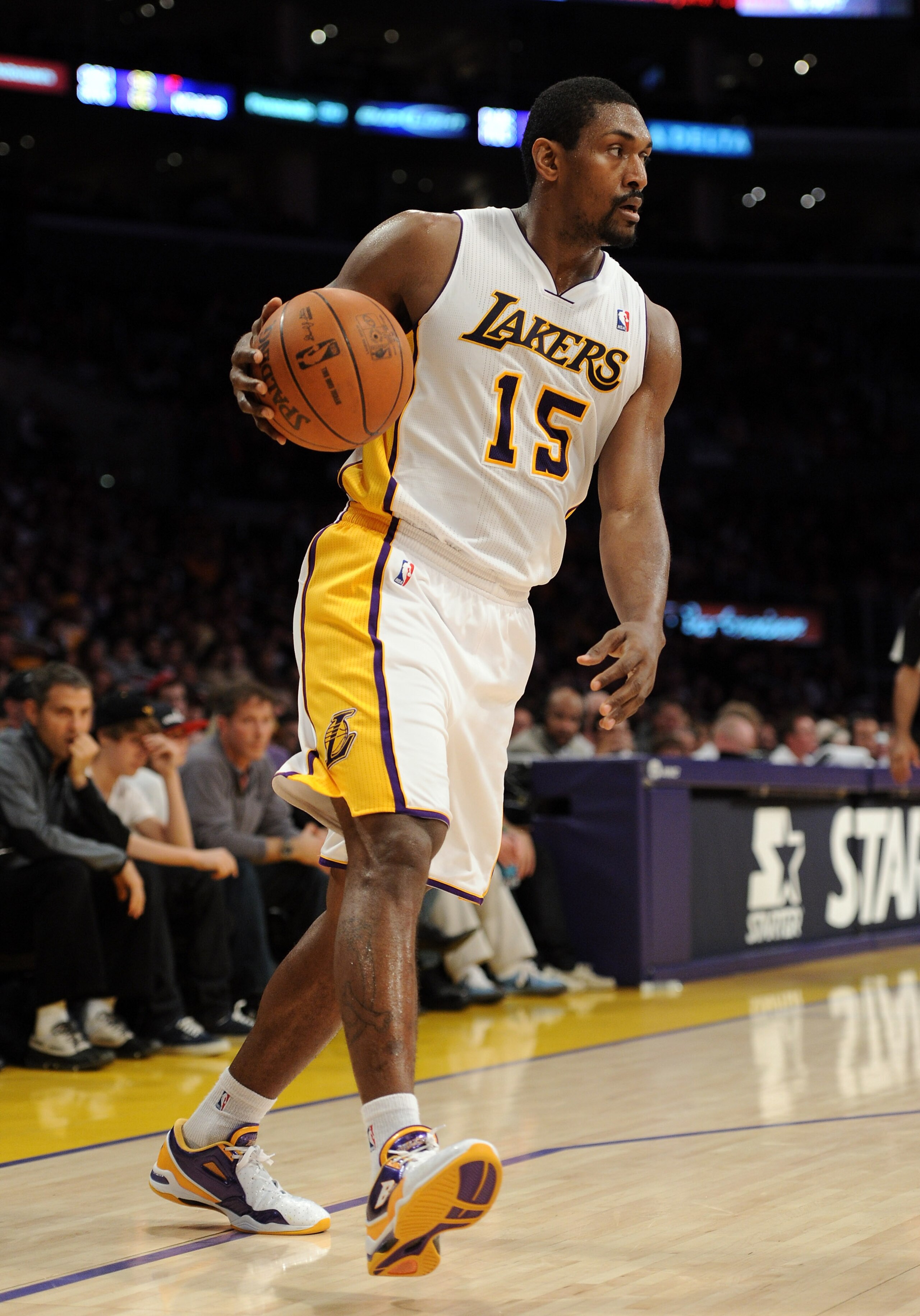 LOS ANGELES, CA - MARCH 20: Ron Artest #15 of the Los Angeles Lakers dribbles against the Portland Trail Blazers at the Staples Center on March 20, 2011 in Los Angeles, California. NOTE TO USER: User expressly acknowledges and agrees that, by downloadin LOS ANGELES, CA - MARCH 20: Ron Artest #15 of the Los Angeles Lakers dribbles against the Portland Trail Blazers at the Staples Center on March 20, 2011 in Los Angeles, California. NOTE TO USER: User expressly acknowledges and agrees that, by downloadin