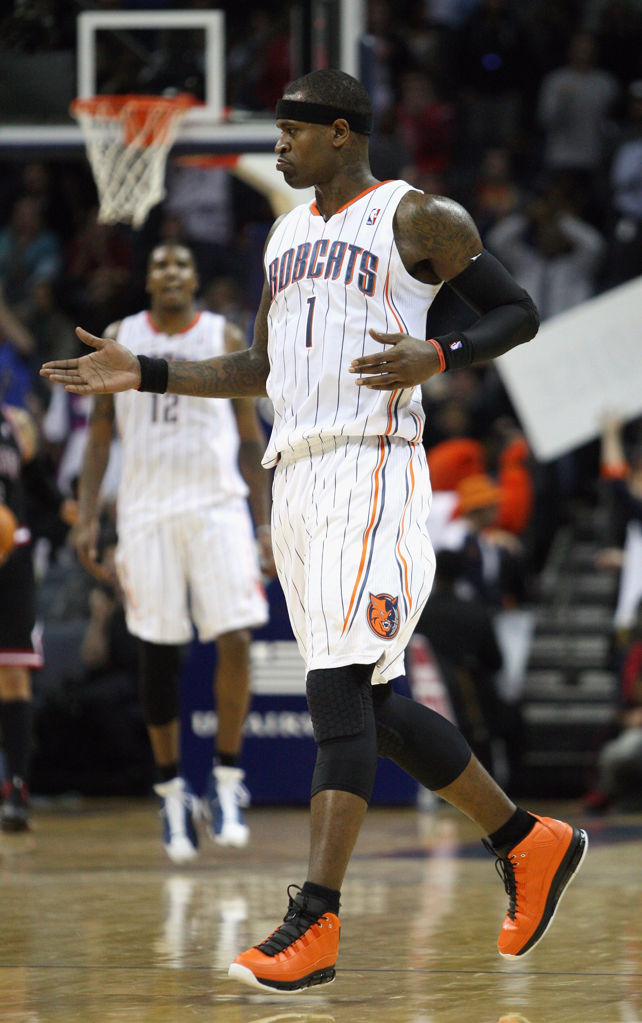 CHARLOTTE, NC - JANUARY 12:  Stephen Jackson #1 of the Charlotte Bobcats celebrates with teammates during their game against the Chicago Bulls at Time Warner Cable Arena on January 12, 2011 in Charlotte, North Carolina. NOTE TO USER: User expressly acknow