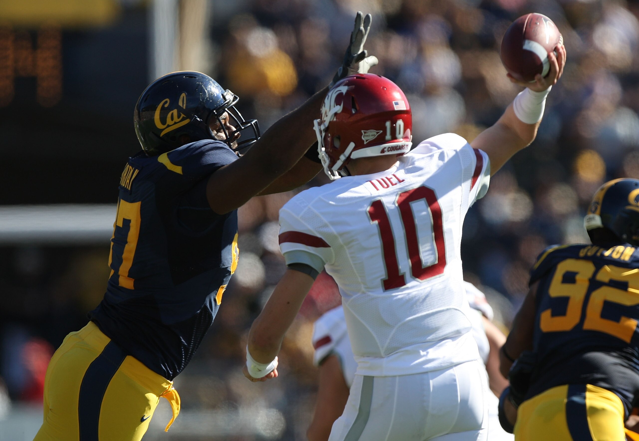 BERKELEY, CA - OCTOBER 24:  Jeff Tuel #10 of the Washington State Cougars passes against Cameron Jordan #97 of the California Golden Bears at California Memorial Stadium on October 24, 2009 in Berkeley, California.  (Photo by Jed Jacobsohn/Getty Images)