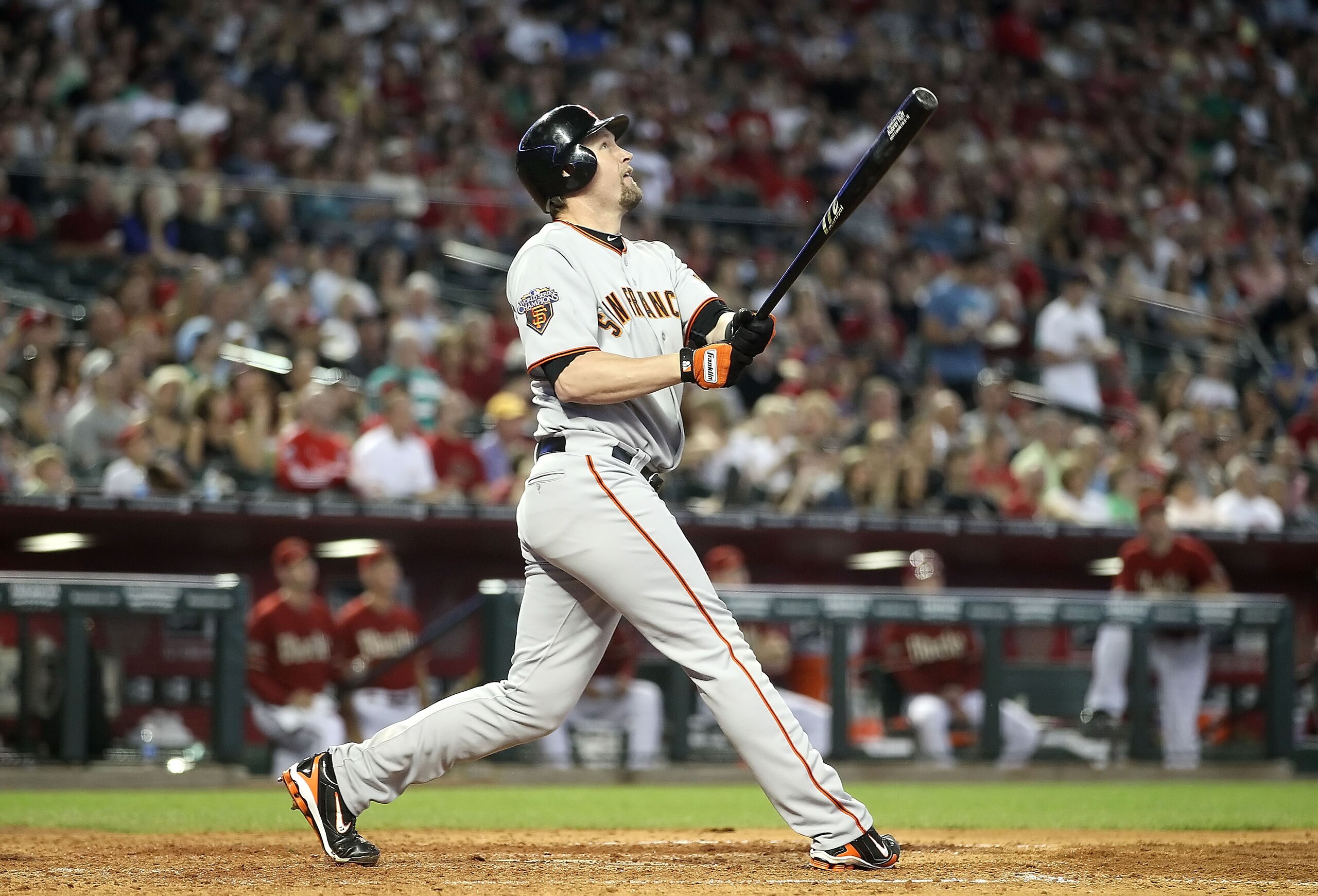PHOENIX, AZ - APRIL 17:  Aubrey Huff #17 of the San Francisco Giants hits a sacrafice fly against the Arizona Diamondbacks during the sixth inning of the Major League Baseball game at Chase Field on April 17, 2011 in Phoenix, Arizona.  (Photo by Christian