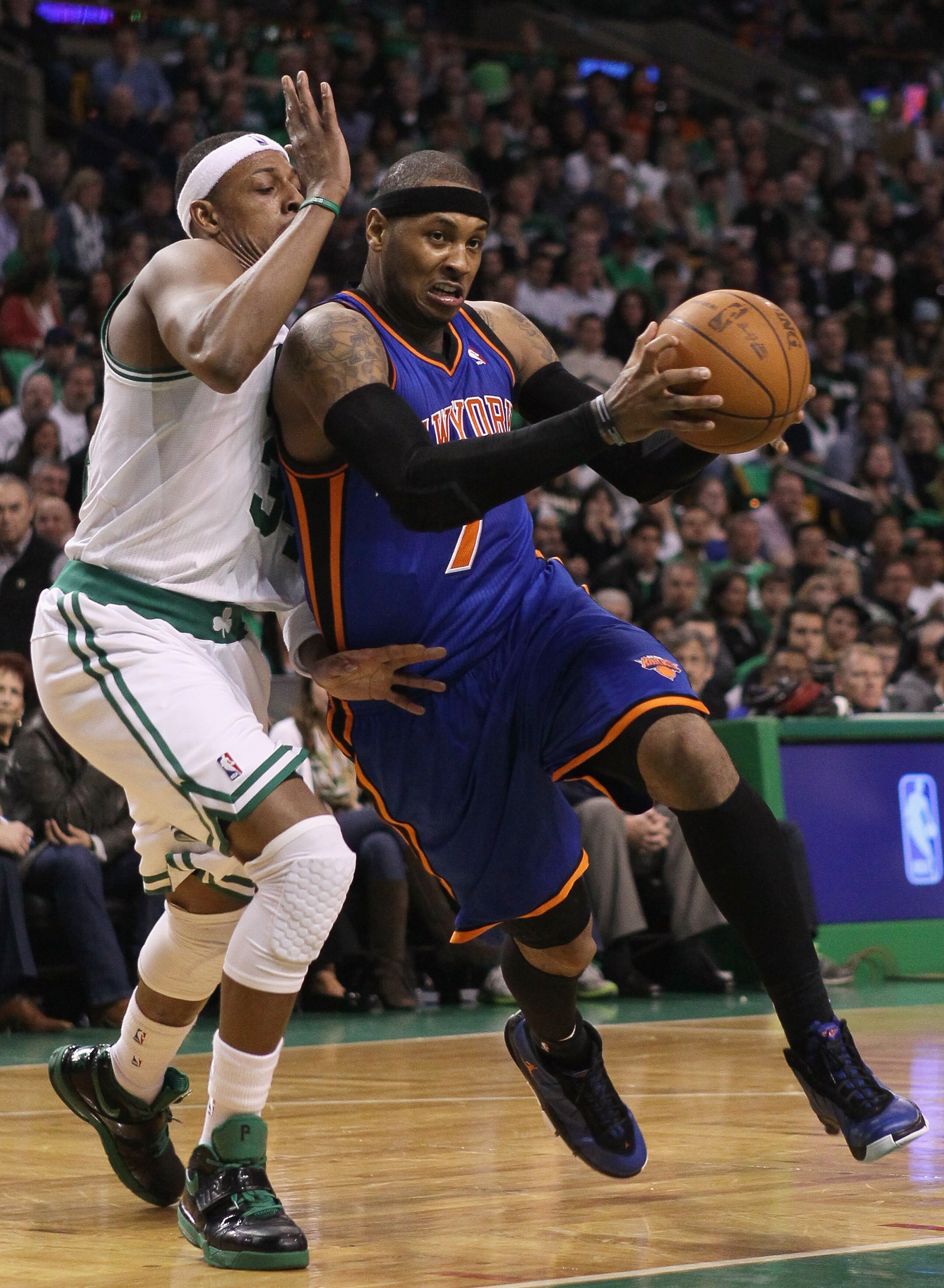 BOSTON, MA - APRIL 17:  Carmelo Anthony #7 of the New York Knicks heads for the net as Paul Pierce #34 of the Boston Celtics defends in Game One of the Eastern Conference Quarterfinals in the 2011 NBA Playoffs on April 17, 2011 at the TD Garden in Boston,