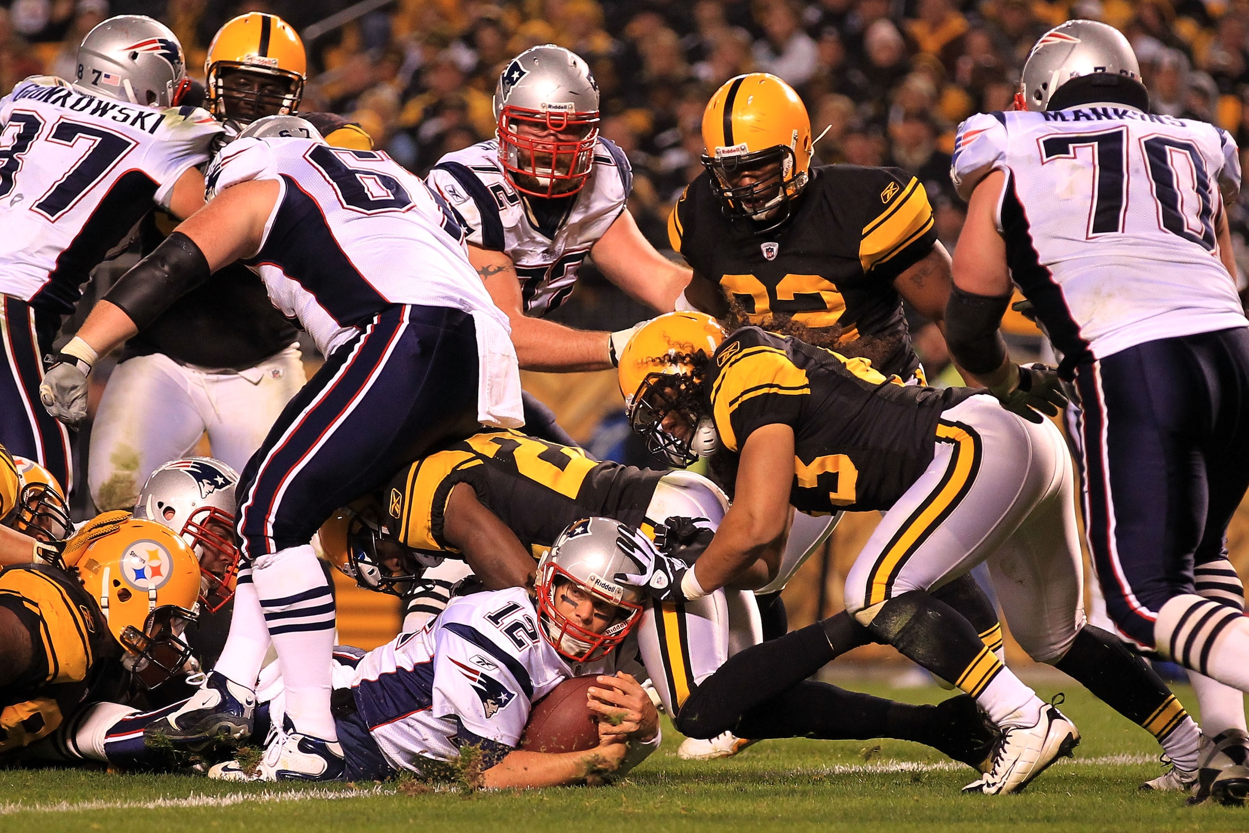 PITTSBURGH - NOVEMBER 14:  Tom Brady #12 of the New England Patriots scores a touchdown against the Pittsburgh Steelers on November 14, 2010 at Heinz Field in Pittsburgh, Pennsylvania.  (Photo by Chris McGrath/Getty Images)