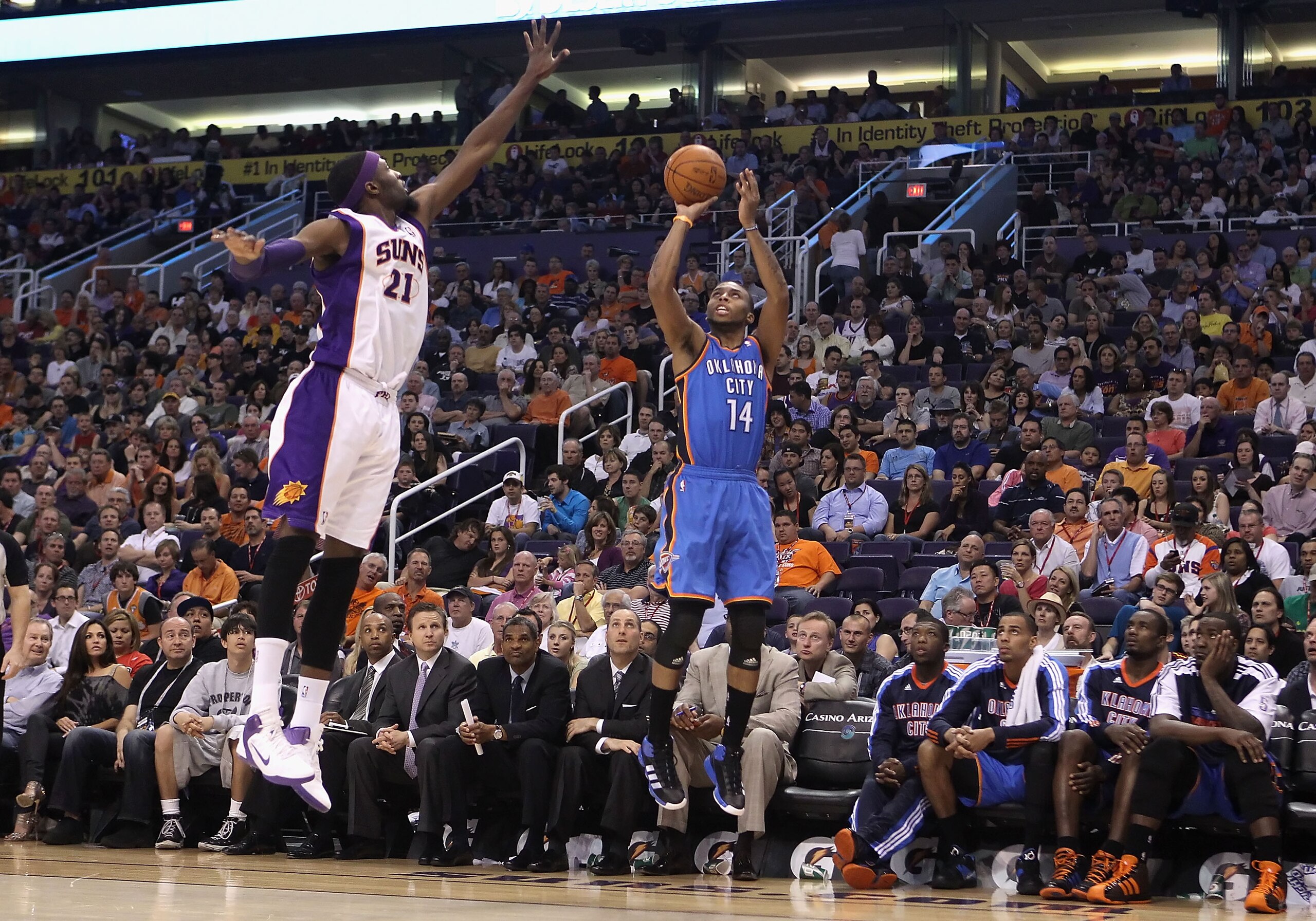 PHOENIX, AZ - MARCH 30: Daequan Cook #14 of the Oklahoma City Thunder puts up a shot during the NBA game against the Phoenix Suns at US Airways Center on March 30, 2011 in Phoenix, Arizona. The Thunder defeated the Suns 116-98. NOTE TO USER: User expre PHOENIX, AZ - MARCH 30: Daequan Cook #14 of the Oklahoma City Thunder puts up a shot during the NBA game against the Phoenix Suns at US Airways Center on March 30, 2011 in Phoenix, Arizona. The Thunder defeated the Suns 116-98. NOTE TO USER: User expre