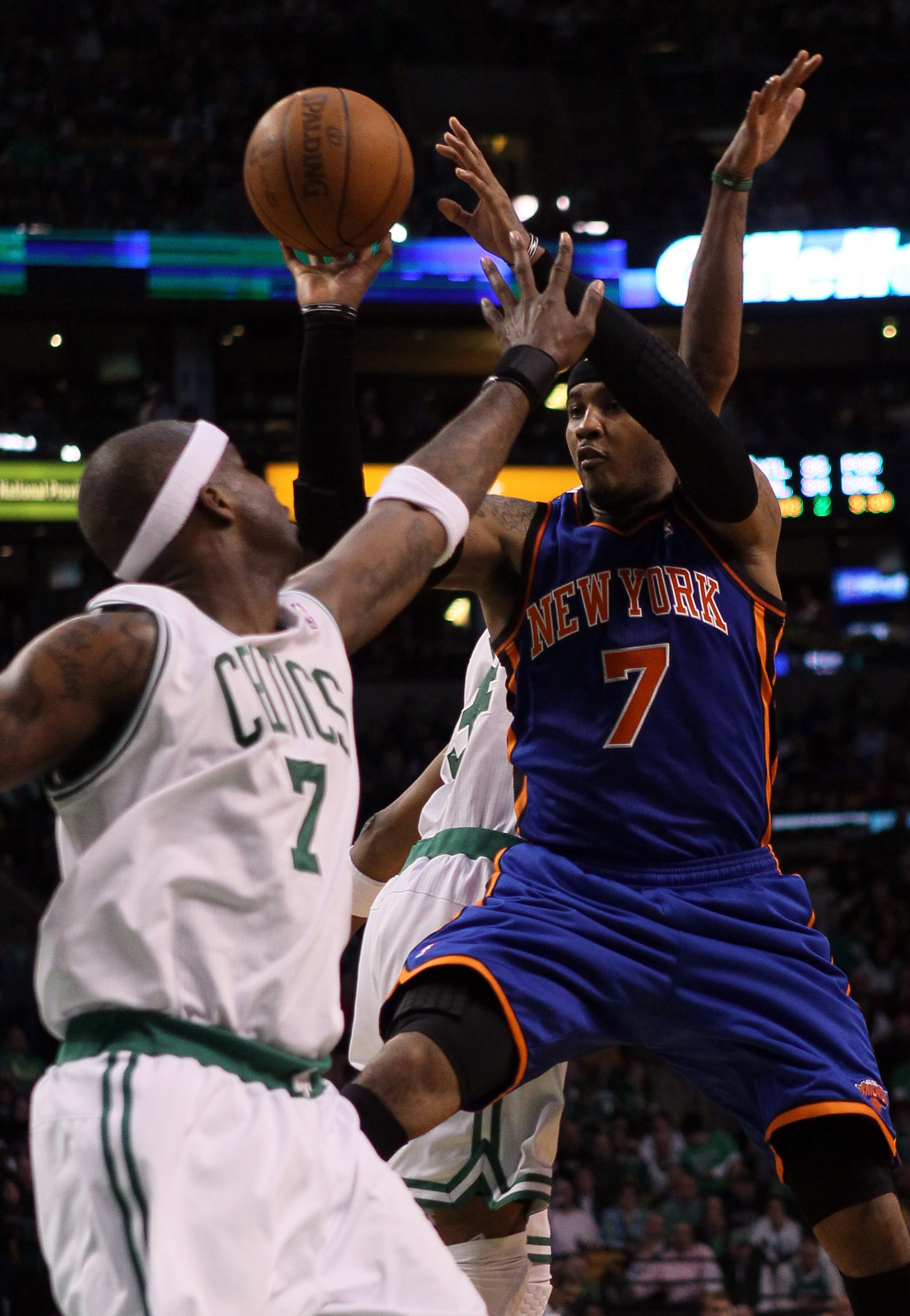 BOSTON, MA - APRIL 19: Carmelo Anthony #7 of the New York Knicks tries to shoot over Jermaine O'Neal #7 of the Boston Celtics in Game Two of the Eastern Conference Quarterfinals in the 2011 NBA Playoffs on April 19, 2011 at the TD Garden in Boston, Massa BOSTON, MA - APRIL 19: Carmelo Anthony #7 of the New York Knicks tries to shoot over Jermaine O'Neal #7 of the Boston Celtics in Game Two of the Eastern Conference Quarterfinals in the 2011 NBA Playoffs on April 19, 2011 at the TD Garden in Boston, Massa