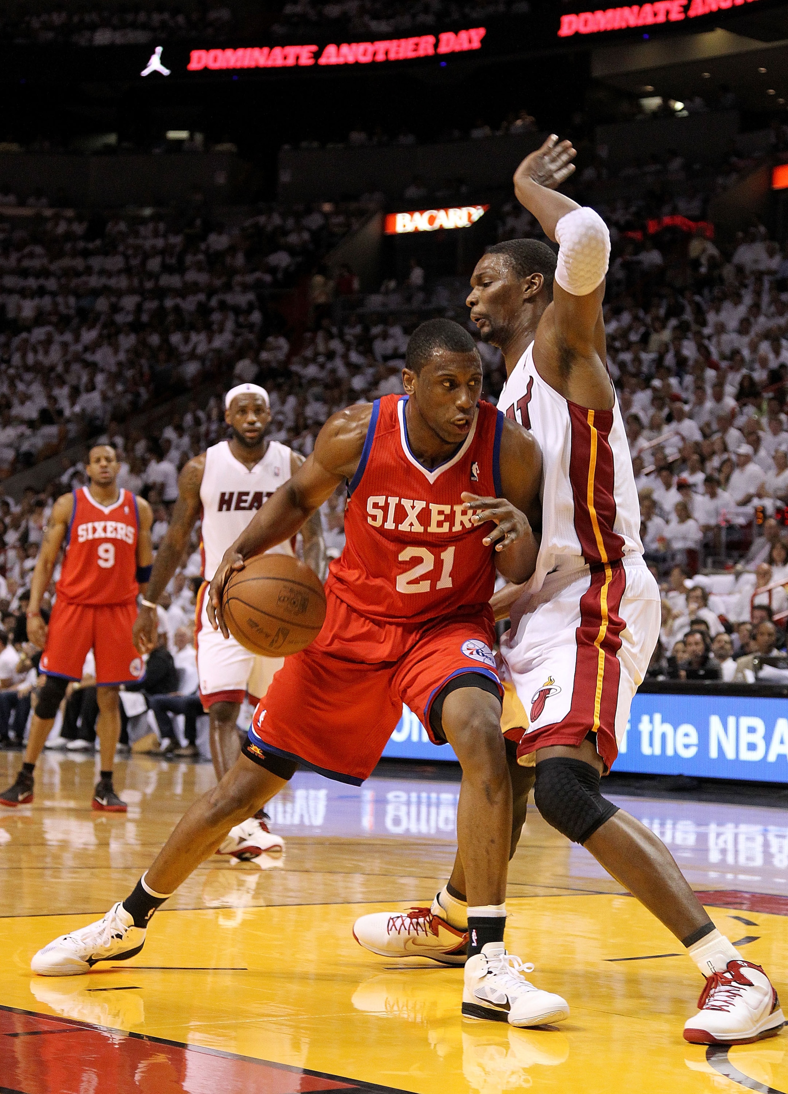 MIAMI, FL - APRIL 18: Thaddeus Young #21 of the Philadelphia 76ers posts up Chris Bosh #1 of the Miami Heat during game two of the Eastern Conference Quarterfinals at American Airlines Arena on April 18, 2011 in Miami, Florida. NOTE TO USER: User expr MIAMI, FL - APRIL 18: Thaddeus Young #21 of the Philadelphia 76ers posts up Chris Bosh #1 of the Miami Heat during game two of the Eastern Conference Quarterfinals at American Airlines Arena on April 18, 2011 in Miami, Florida. NOTE TO USER: User expr