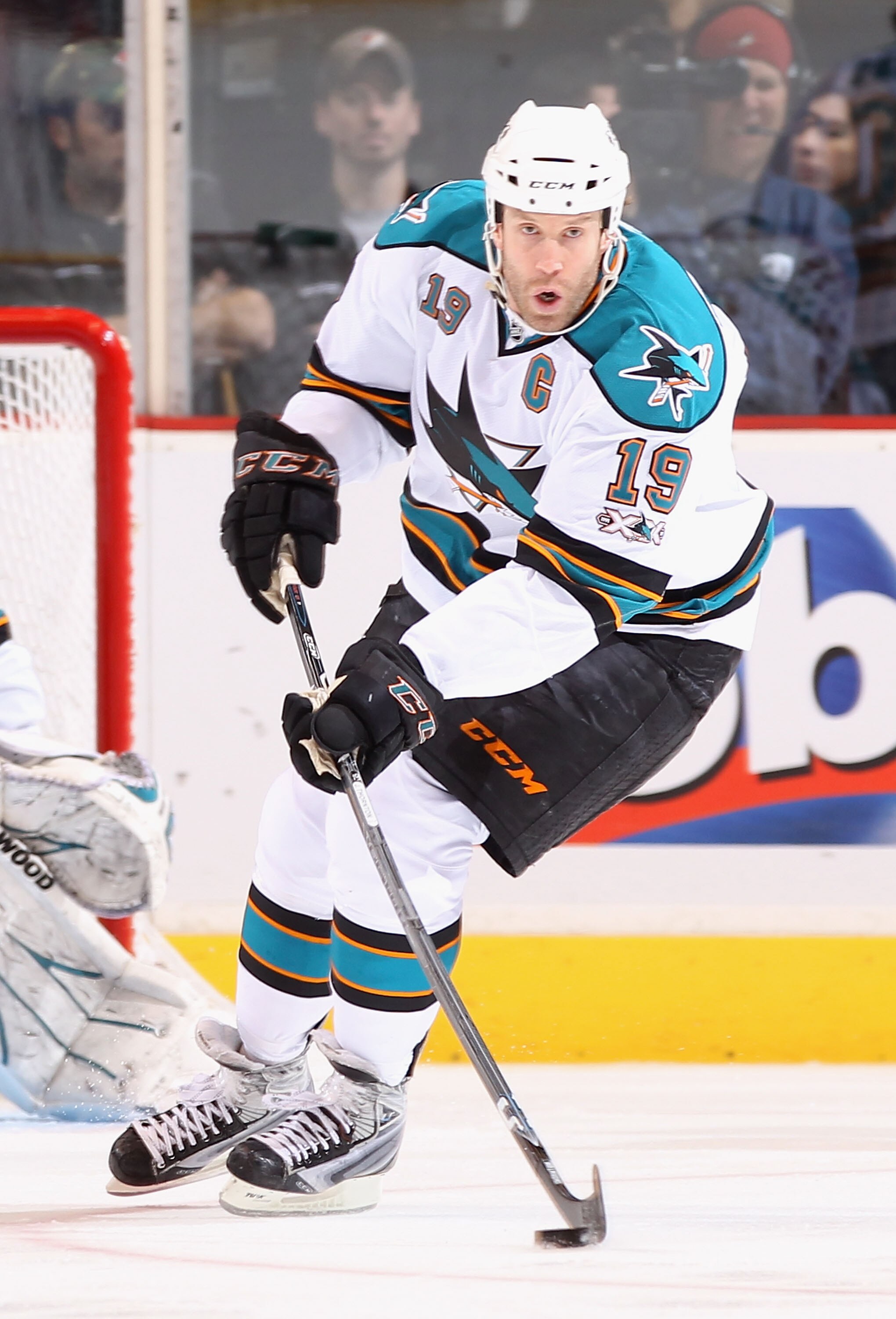GLENDALE, AZ - MARCH 26:  Joe Thornton #19 of the San Jose Sharks skates with the puck during the NHL game against the Phoenix Coyotes at Jobing.com Arena on March 26, 2011 in Glendale, Arizona. The Sharks defeated the Coyotes 4-1.  (Photo by Christian Pe