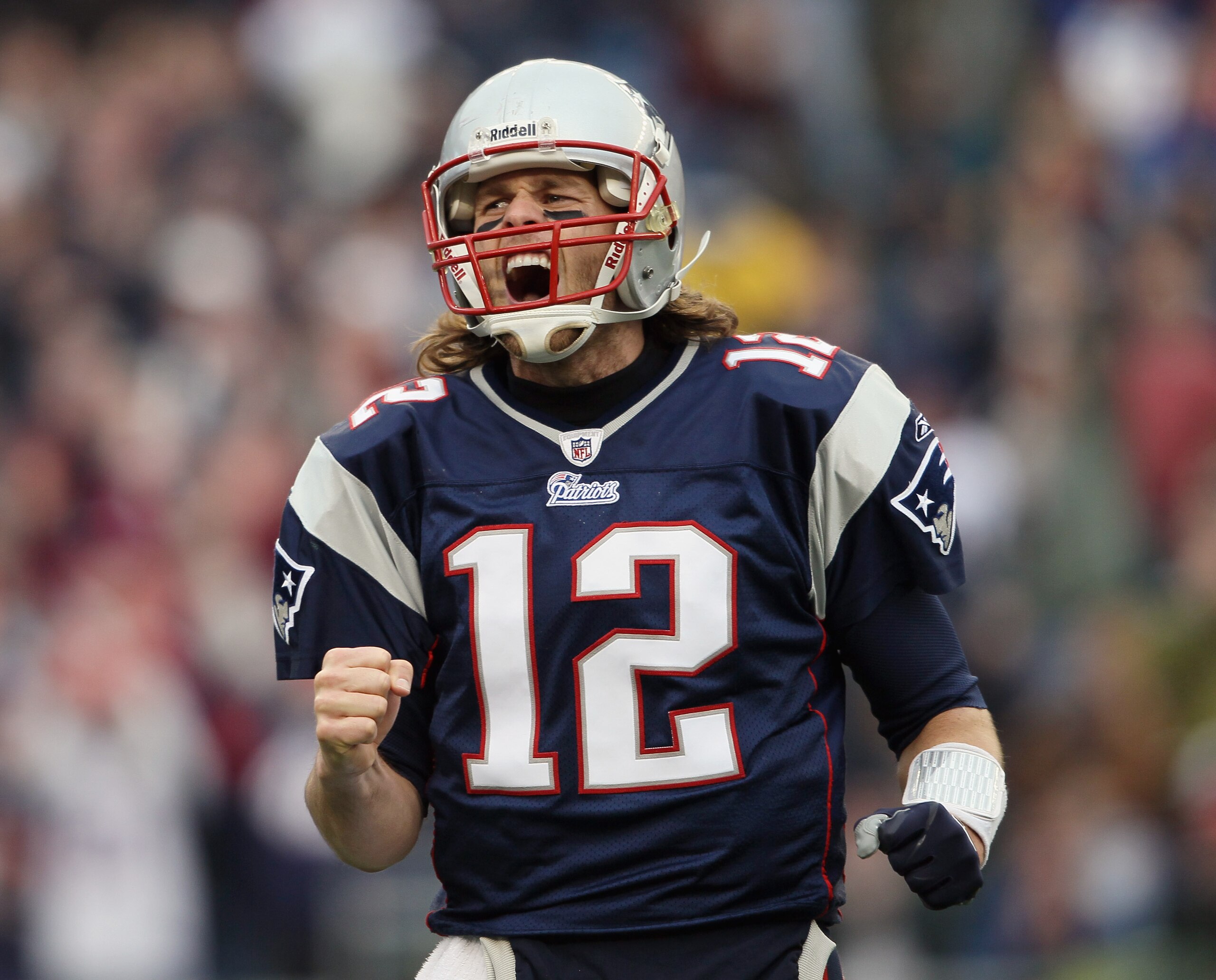 FOXBORO, MA - JANUARY 02:  Tom Brady #12 of the New England Patriots celebrates a touchdown by teammate BenJarvis Green-Ellis in the first quarter against the Miami Dolphins on January 2, 2011 at Gillette Stadium in Foxboro, Massachusetts.  (Photo by Elsa