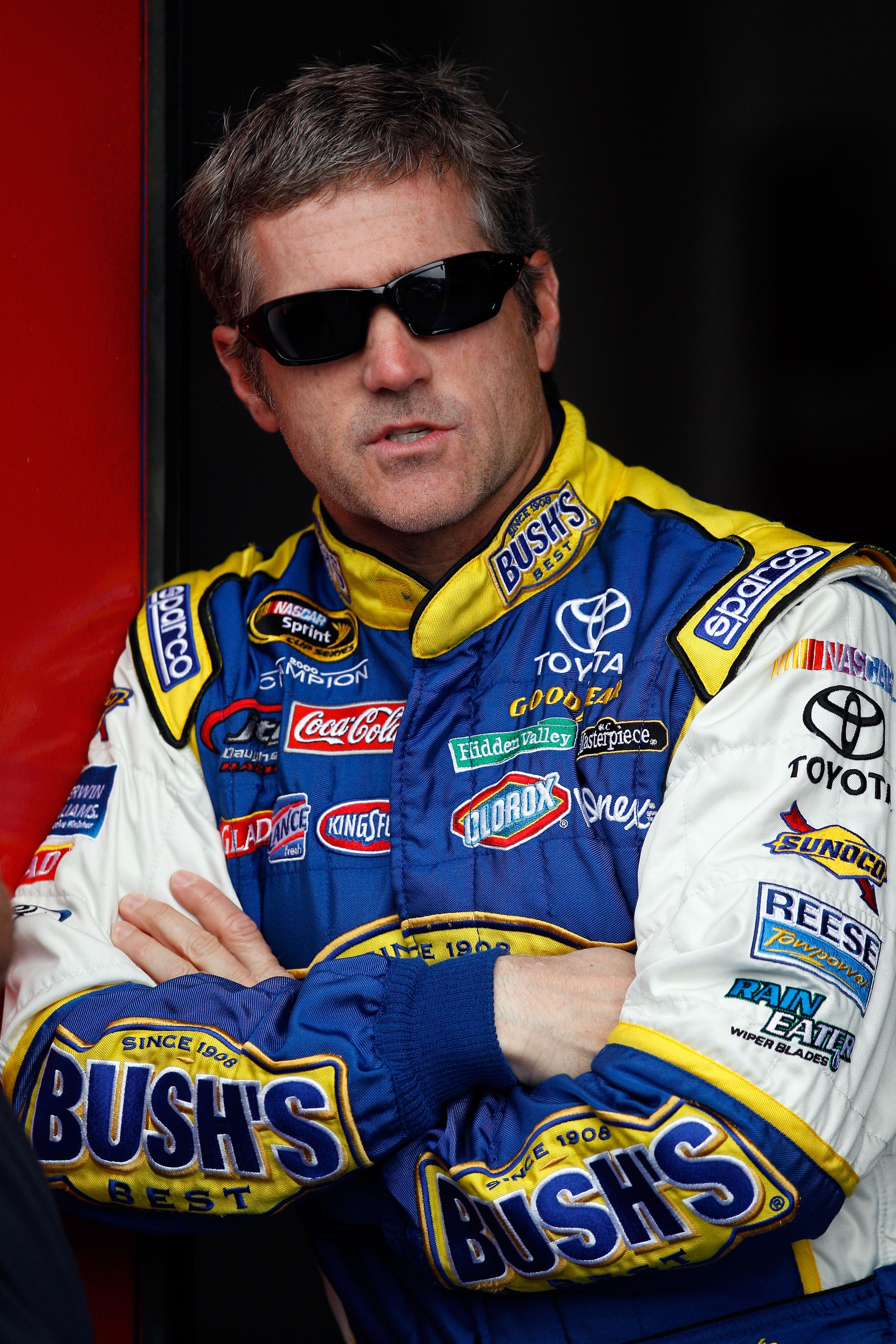 TALLADEGA, AL - APRIL 15: Bobby Labonte, driver of the #47 Bush's Baked Beans Toyota, stands in the garage during practice for the NASCAR Sprint Cup Series Aaron's 499 at Talladega Superspeedway on April 15, 2011 in Talladega, Alabama.  (Photo by Chris Gr