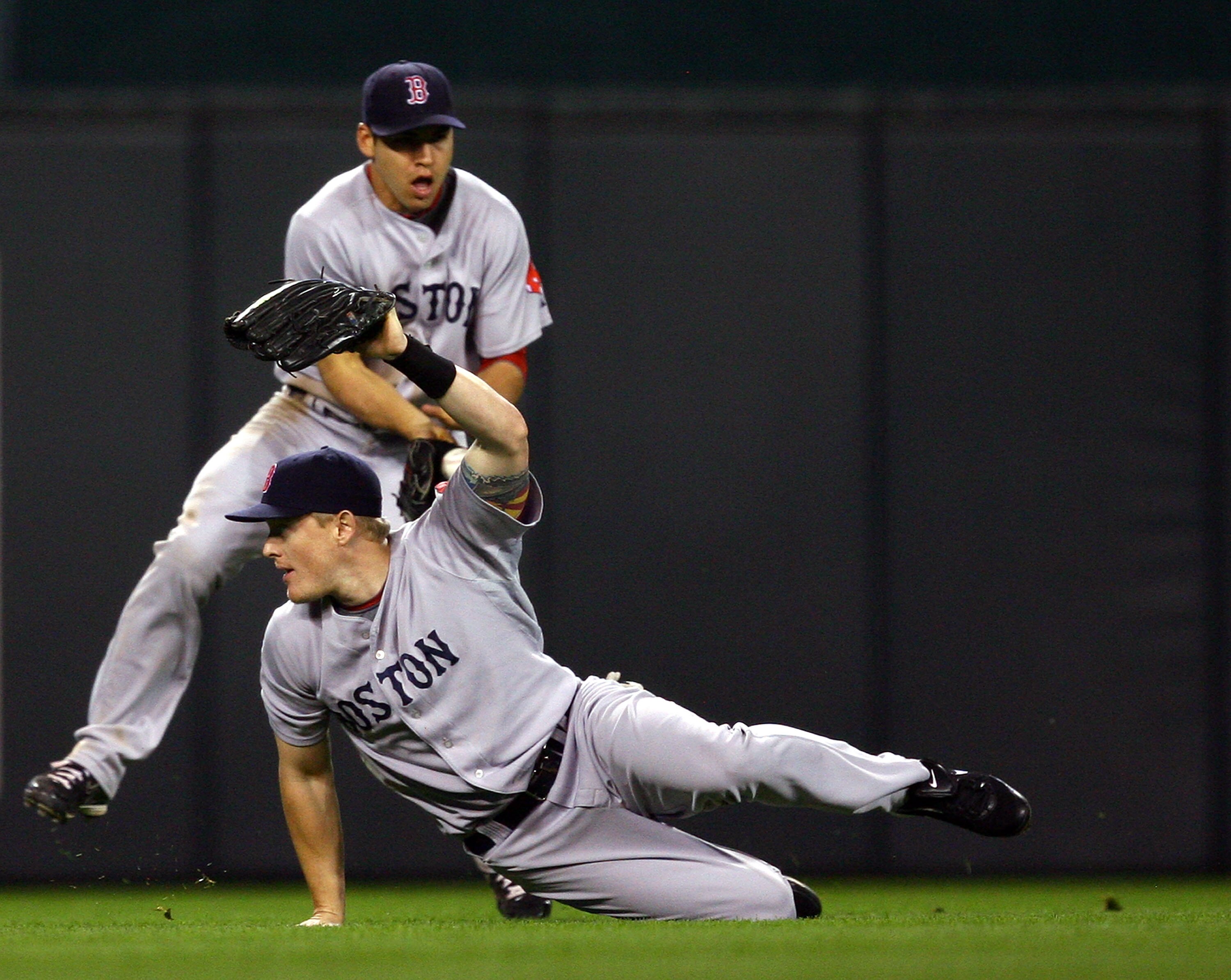 KANSAS CITY, MO - SEPTEMBER 24:  Jason Bay #44 and Jacoby Ellsbury #46 of the Boston Red Sox fail to catch a blooper off the bat of Alberto Callaspo #13 of the Kansas City Royals during the 8th inning of the game on September 24, 2009 at Kauffman Stadium