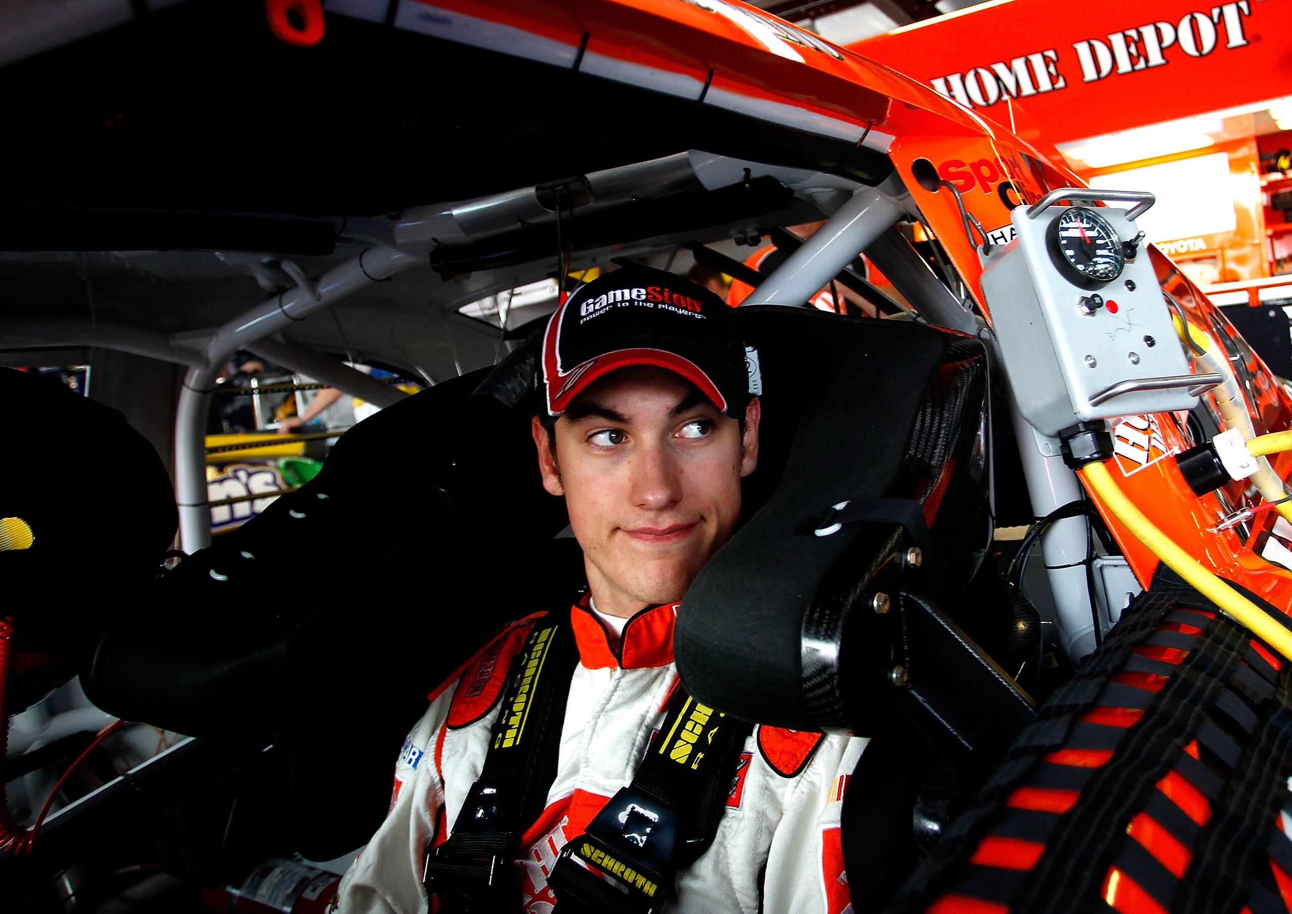 TALLADEGA, AL - APRIL 15:  Joey Logano, driver of the #20 The Home Depot Toyota, sits in the garage during practice for the NASCAR Sprint Cup Series Aaron's 499 at Talladega Superspeedway on April 15, 2011 in Talladega, Alabama.  (Photo by Jeff Zelevansky