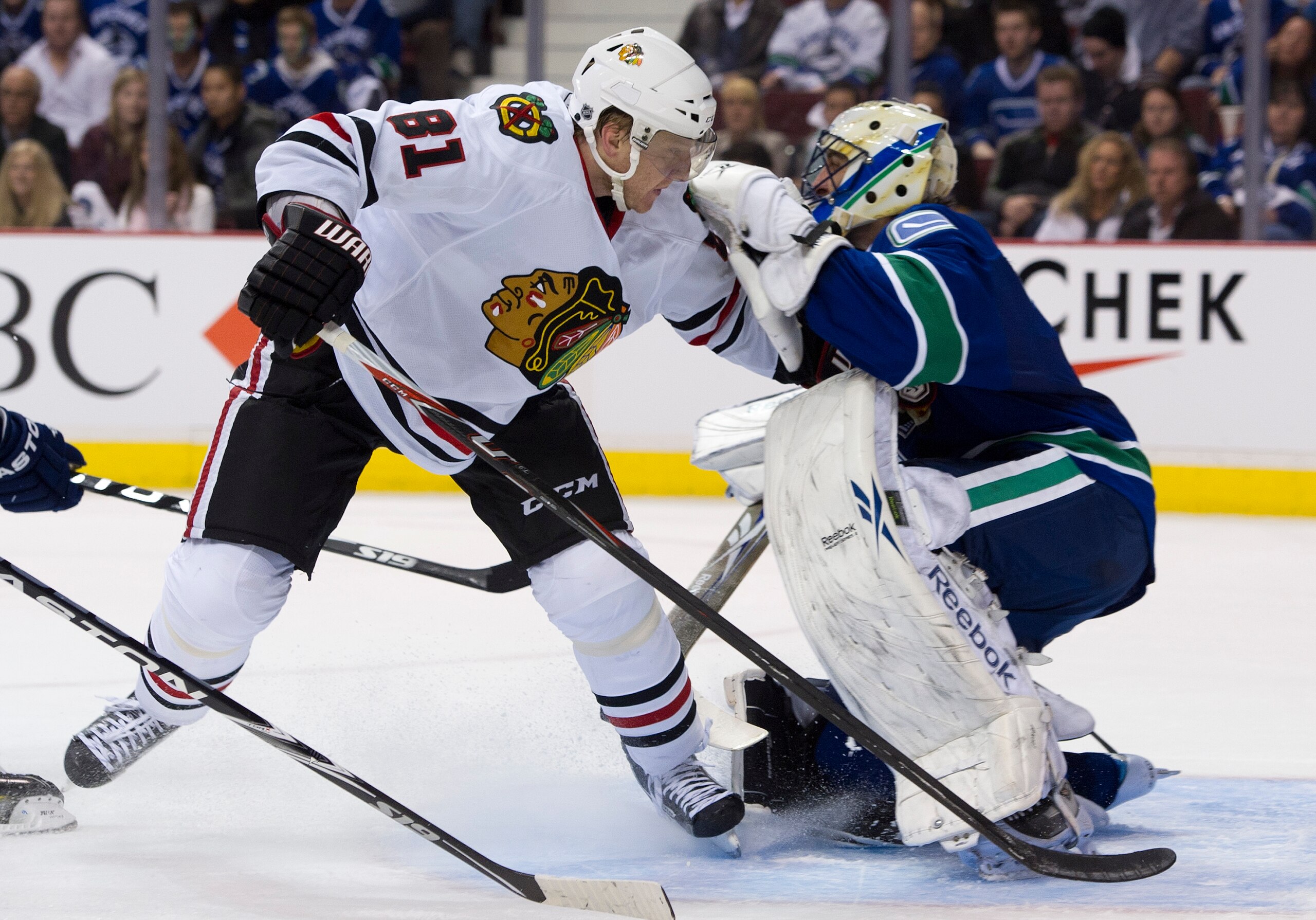 VANCOUVER, CANADA - APRIL 13: Marian Hossa #81 of the Chicago Blackhawks skates into goalie Roberto Luongo #1 after getting pushed during the third period in Game One of the Western Conference Quarterfinals during the 2011 NHL Stanley Cup Playoffs on Apri