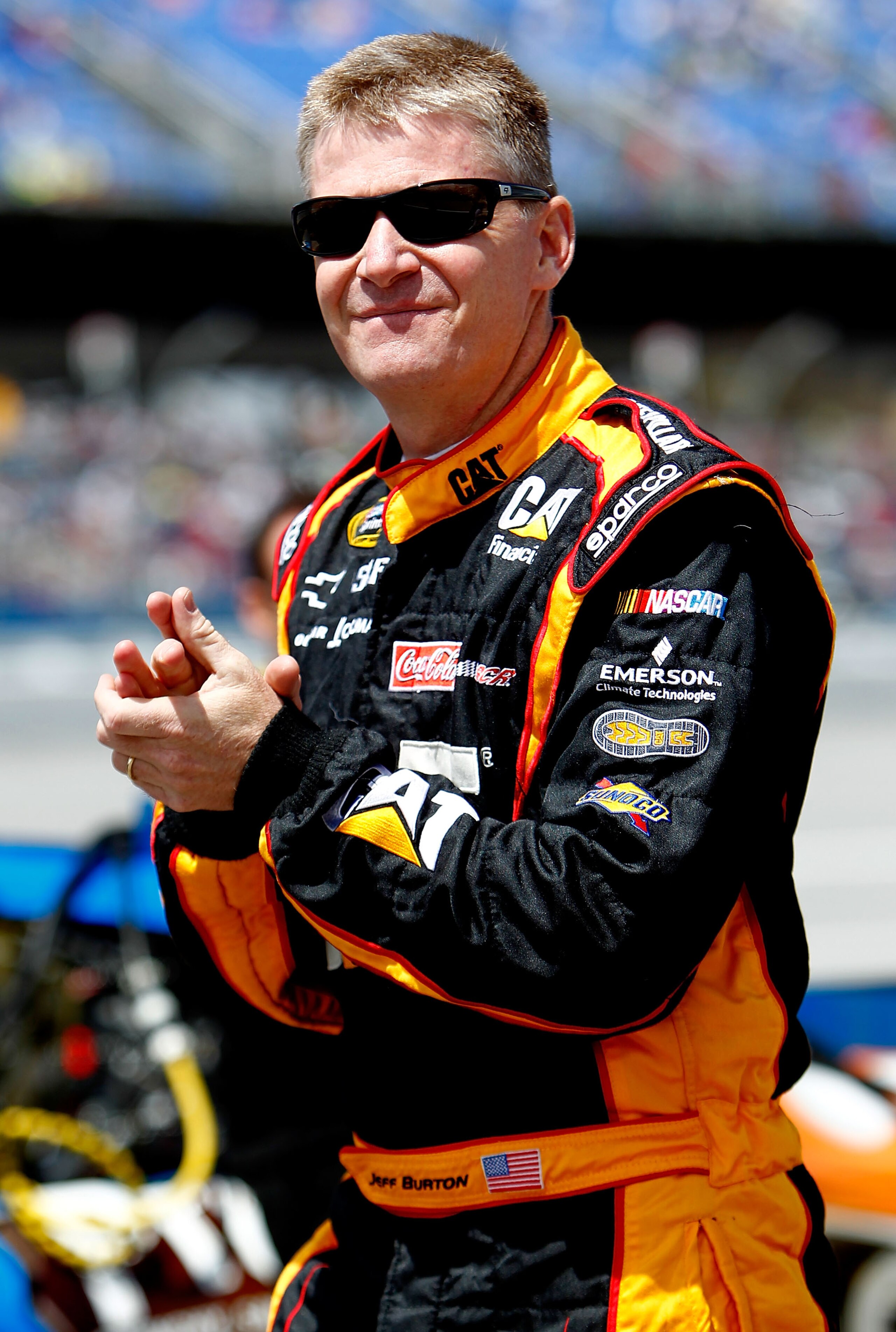 TALLADEGA, AL - APRIL 16:  Jeff Burton, driver of the #31 Cat Financial Chevrolet, walks on the grid during qualifying for the NASCAR Sprint Cup Series Aaron's 499 at Talladega Superspeedway on April 16, 2011 in Talladega, Alabama.  (Photo by Jeff Zelevan