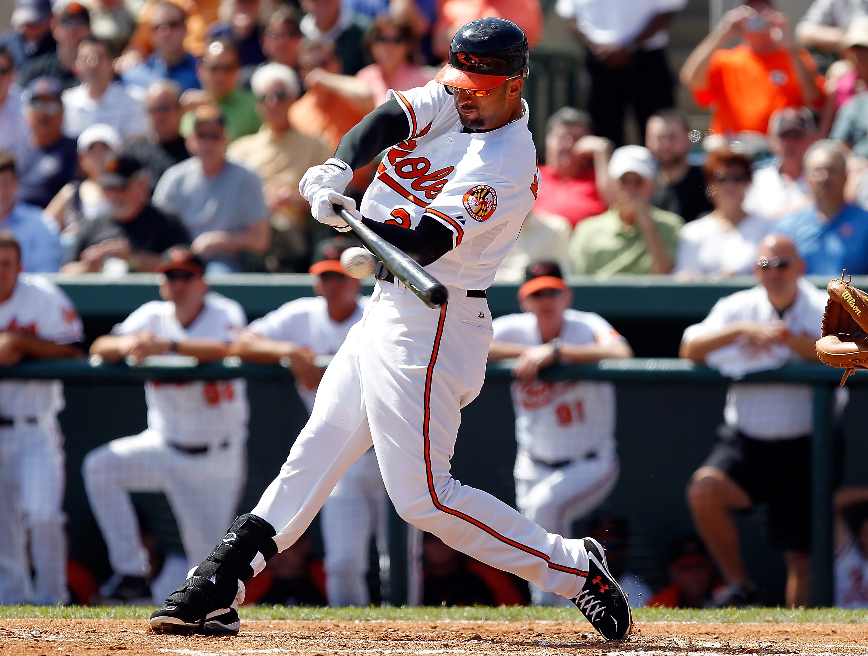 SARASOTA, FL - MARCH 03:  Outfielder Nick Markakis #21 of the Baltimore Orioles fouls off a pitch against the Minnesota Twins during a Grapefruit League Spring Training Game at Ed Smith Stadium on March 3, 2011 in Sarasota, Florida.  (Photo by J. Meric/Ge