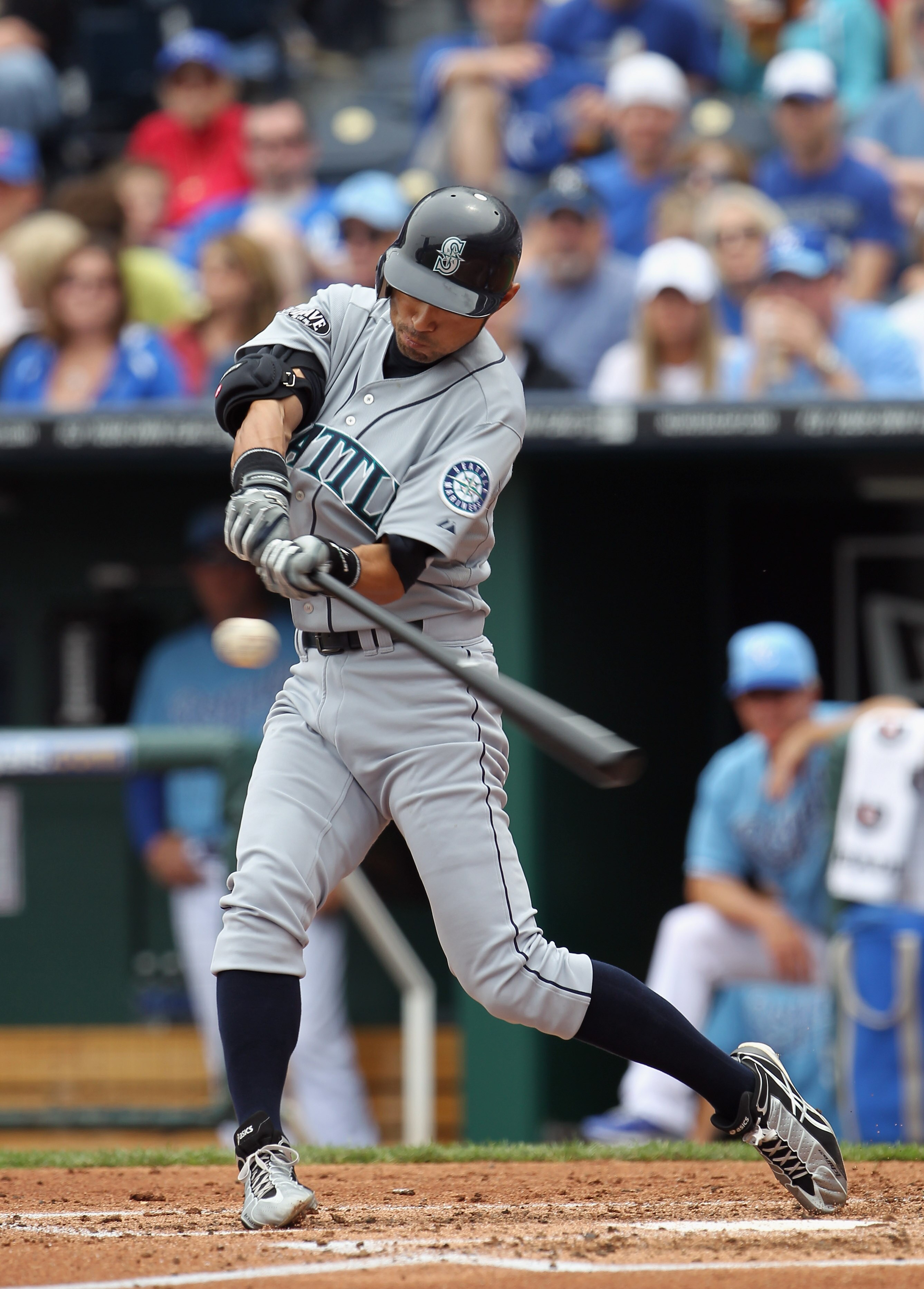 KANSAS CITY, MO - APRIL 17:  Ichiro Suzuki #51 of the Seattle Mariners makes contact during the game against the Kansas City Royals on April 17, 2011 at Kauffman Stadium in Kansas City, Missouri.  (Photo by Jamie Squire/Getty Images)
