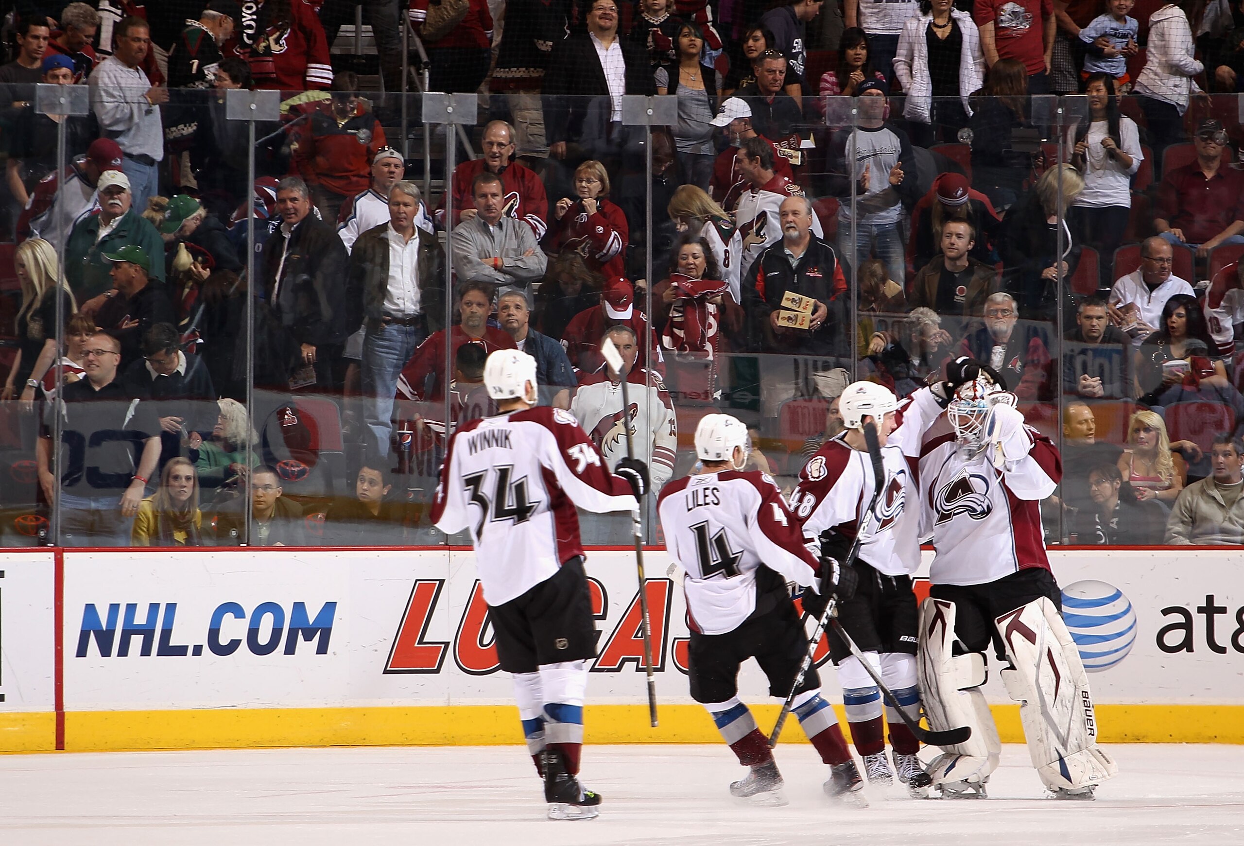 GLENDALE, AZ - APRIL 01:  Goaltender Peter Budaj #31 of the Colorado Avalanche is congratulated by teammates after defeating the Phoenix Coyotes in the NHL game at Jobing.com Arena on April 1, 2011 in Glendale, Arizona. The Avalanche defeated the Coyotes
