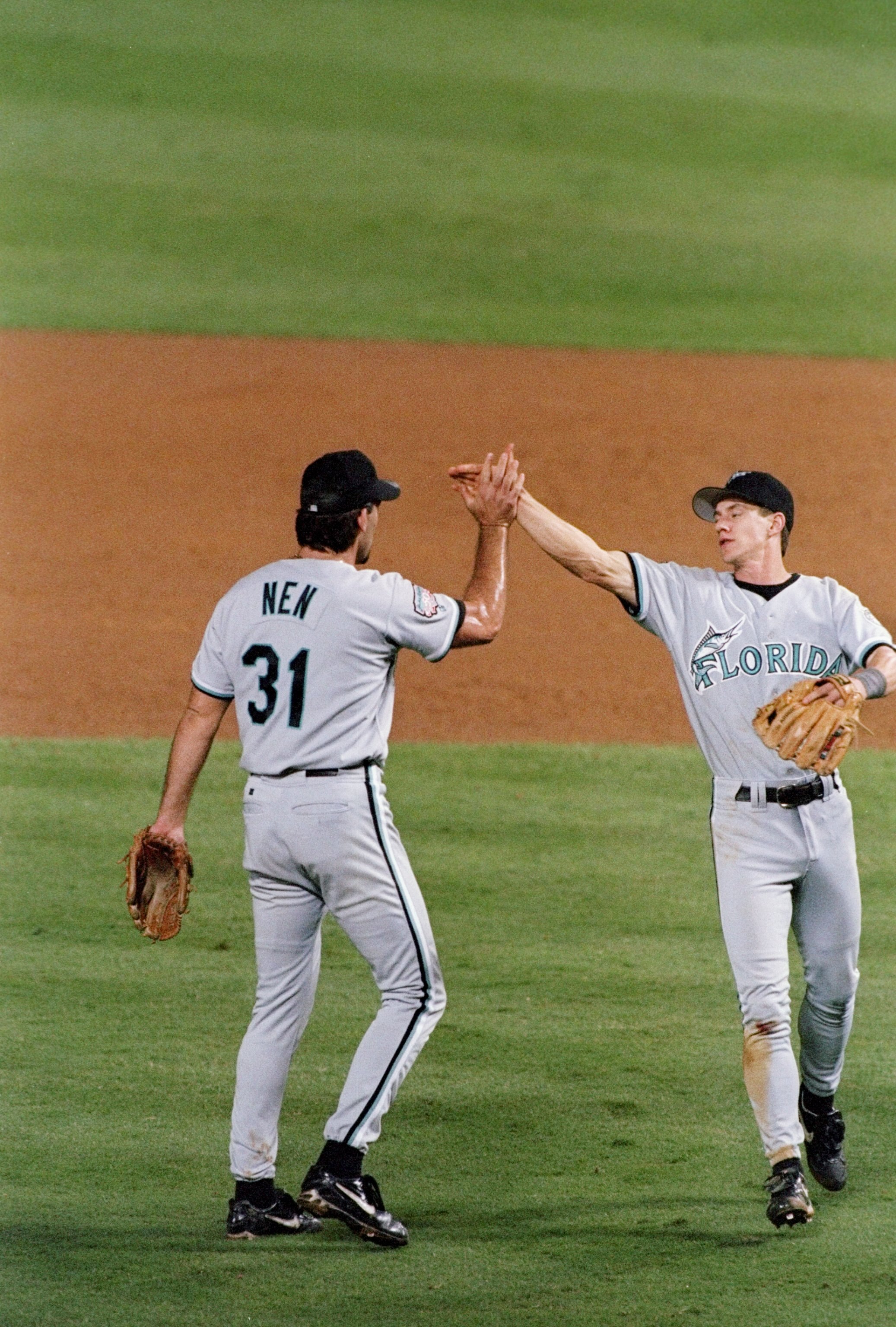 7 Oct 1997: Pitcher Rob Nen (left) and infielder Craig Counsell of the Florida Marlins celebrate during a game against the Atlanta Braves at Turner Field in Atlanta, Georgia. The Marlins won the game, 5-3.