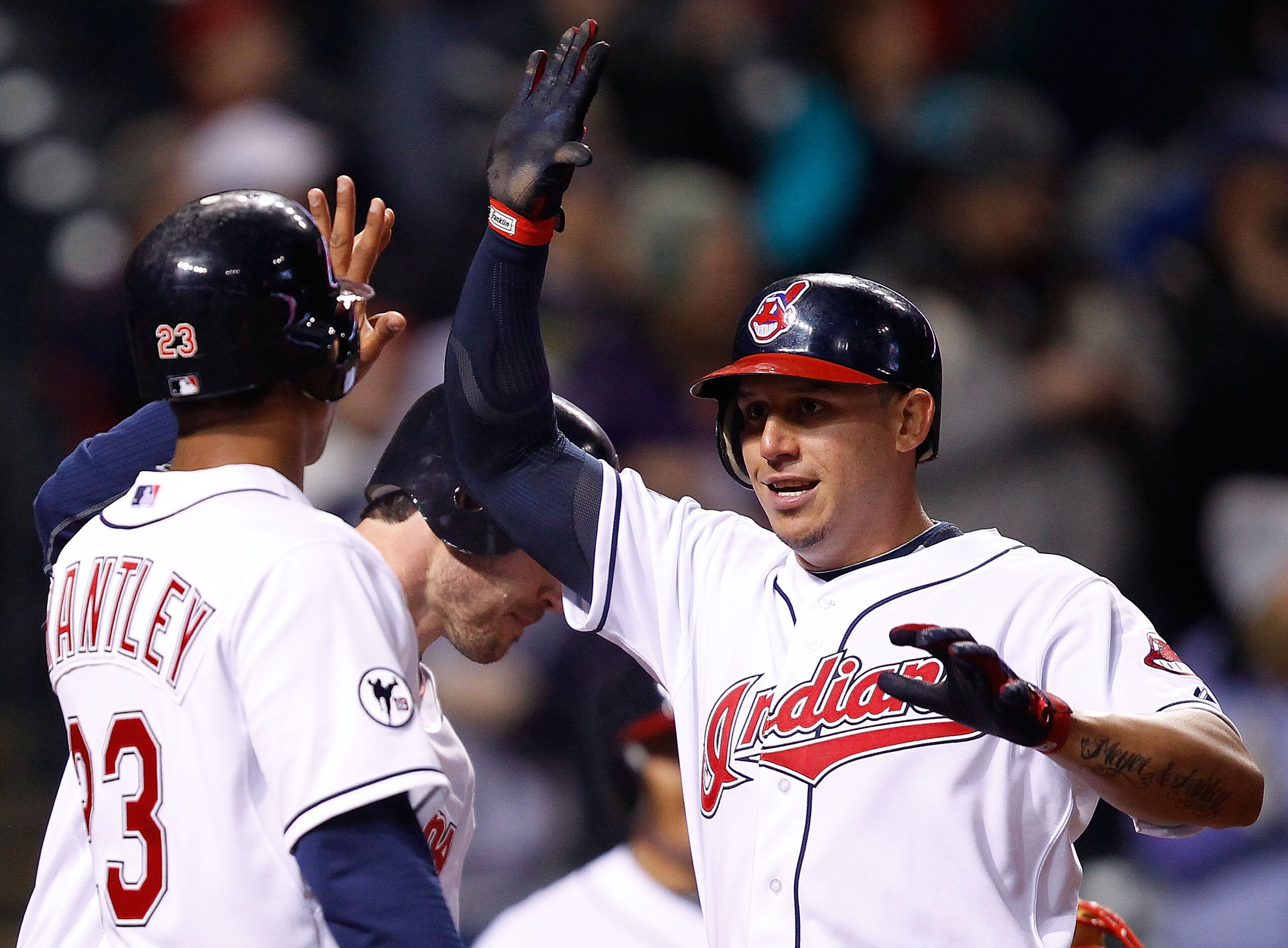 CLEVELAND - APRIL 06:  Asdrubal Cabrera #13 of the Cleveland Indians celebrates with his teammates after hitting a three run home run against he Boston Red Sox during the game on April 6, 2011 at Progressive Field in Cleveland, Ohio.  (Photo by Jared Wick