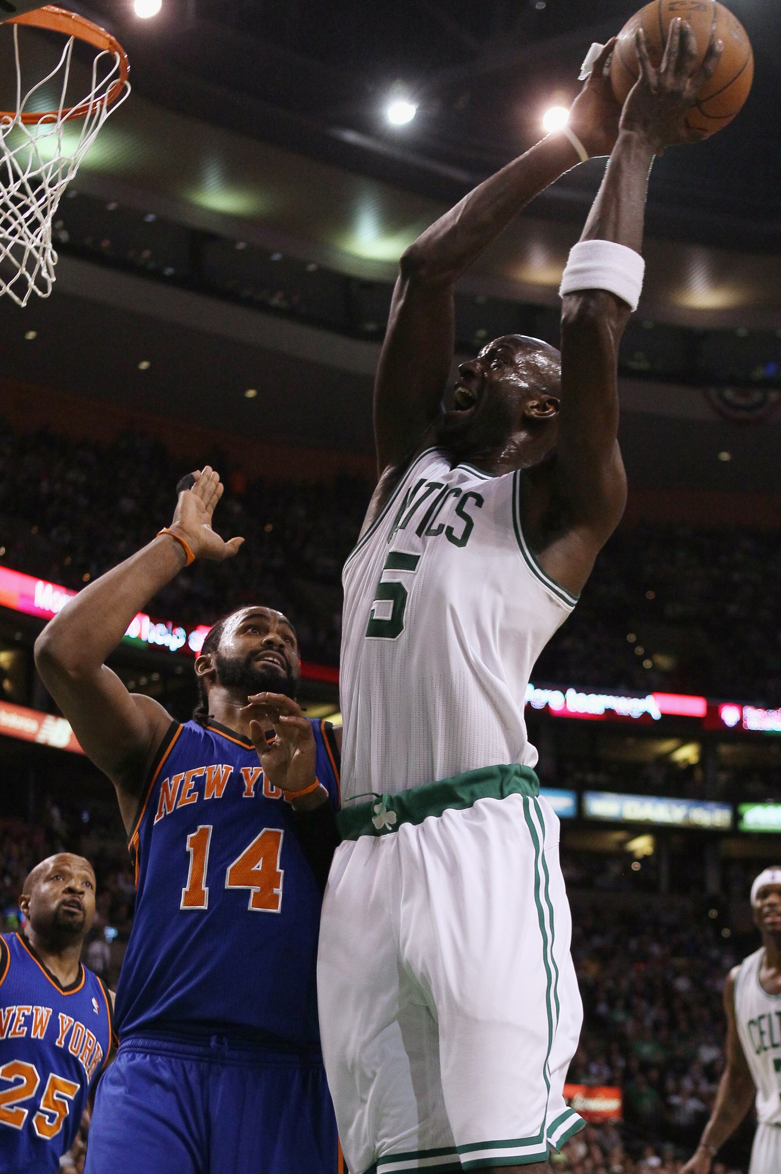 BOSTON, MA - APRIL 19:  Kevin Garnett #5 of the Boston Celtics takes a shot as Ronny Turiaf #14 of the New York Knicks defends in Game Two of the Eastern Conference Quarterfinals in the 2011 NBA Playoffs on April 19, 2011 at the TD Garden in Boston, Massa