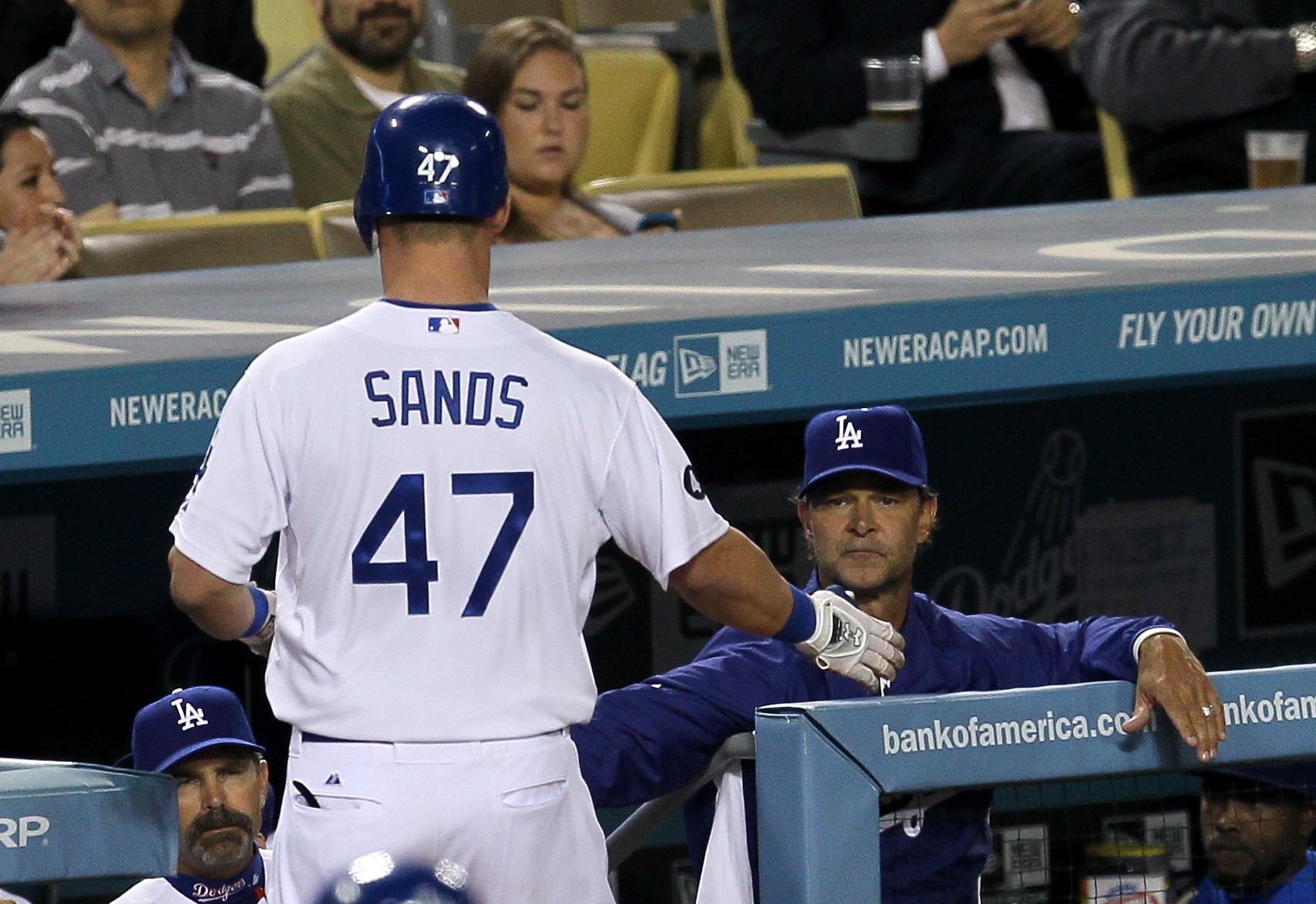LOS ANGELES, CA - APRIL 18:  Jerry Sands #47 of the Los Angeles Dodgers is greeted by manager Don Mattingly as he returns to the dugout after recording his first Major League RBI with a sacrifice fly in the third inning the Atlanta Braves on April 18, 201