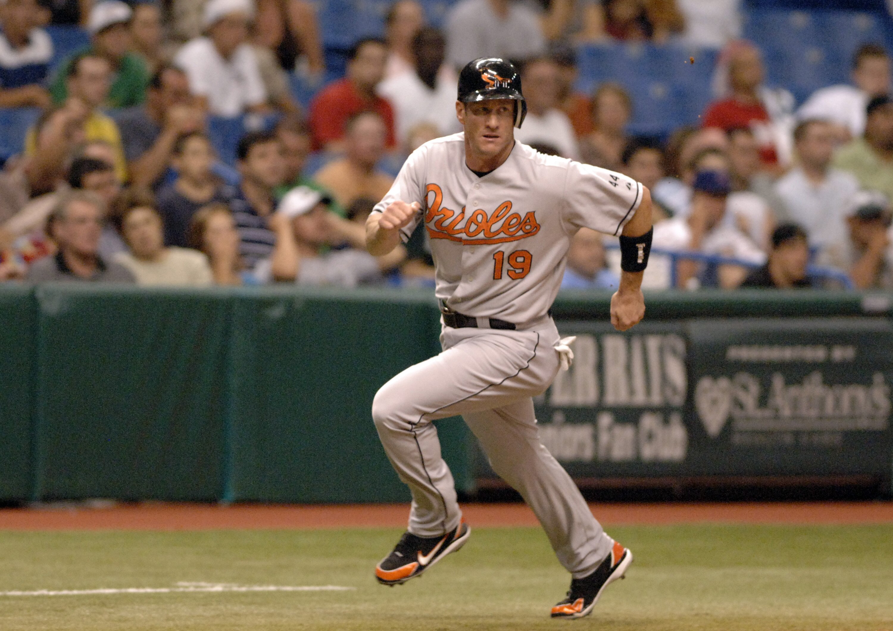 Baltimore Orioles first baseman Jeff Conine rounds third base and scores  against the Tampa Bay Devil Rays at Tropicana Field in St. Petersburg, Florida on July 22, 2006.  (Photo by A. Messerschmidt/Getty Images)