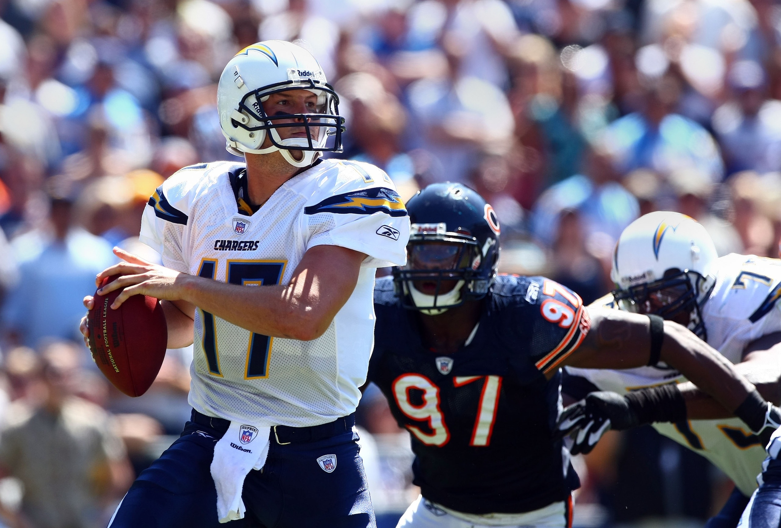 SAN DIEGO - SEPTEMBER 9:  Starting Quarterback Philip Rivers #17 of the San Diego Chargers is sacked by Mark Anderson #97 and Darwin Walker #99 of the Chicago Bears at Qualcomm Stadium September 9, 2007 in San Diego, California.  (Photo by Donald Miralle/