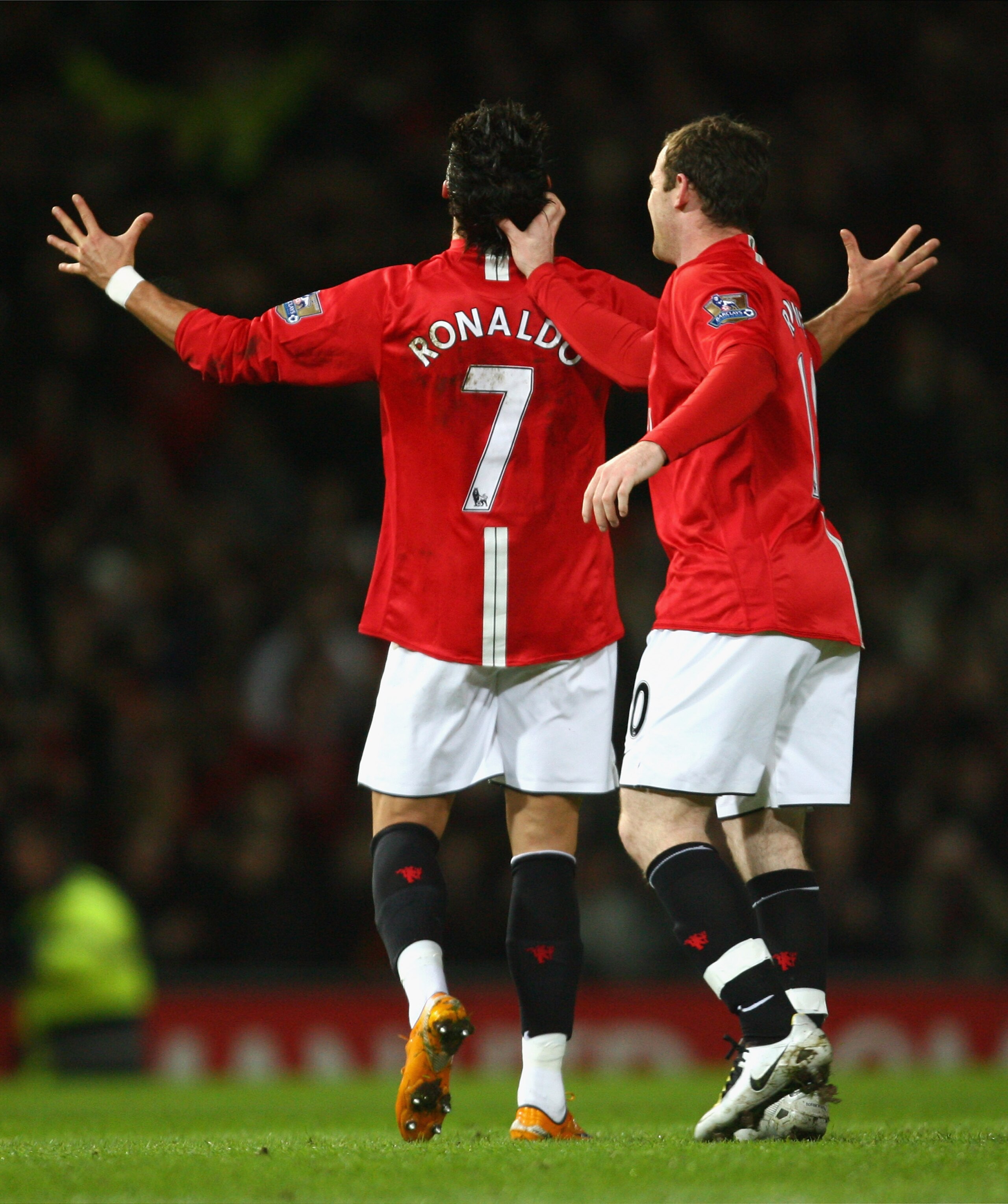 MANCHESTER, UNITED KINGDOM - JANUARY 30: Cristiano Ronaldo of Manchester United is congratulated by team mate Wayne Rooney after scoring his team's second goal during the Barclays Premier League match between Manchester United and Portsmouth at Old Traff MANCHESTER, UNITED KINGDOM - JANUARY 30: Cristiano Ronaldo of Manchester United is congratulated by team mate Wayne Rooney after scoring his team's second goal during the Barclays Premier League match between Manchester United and Portsmouth at Old Traff