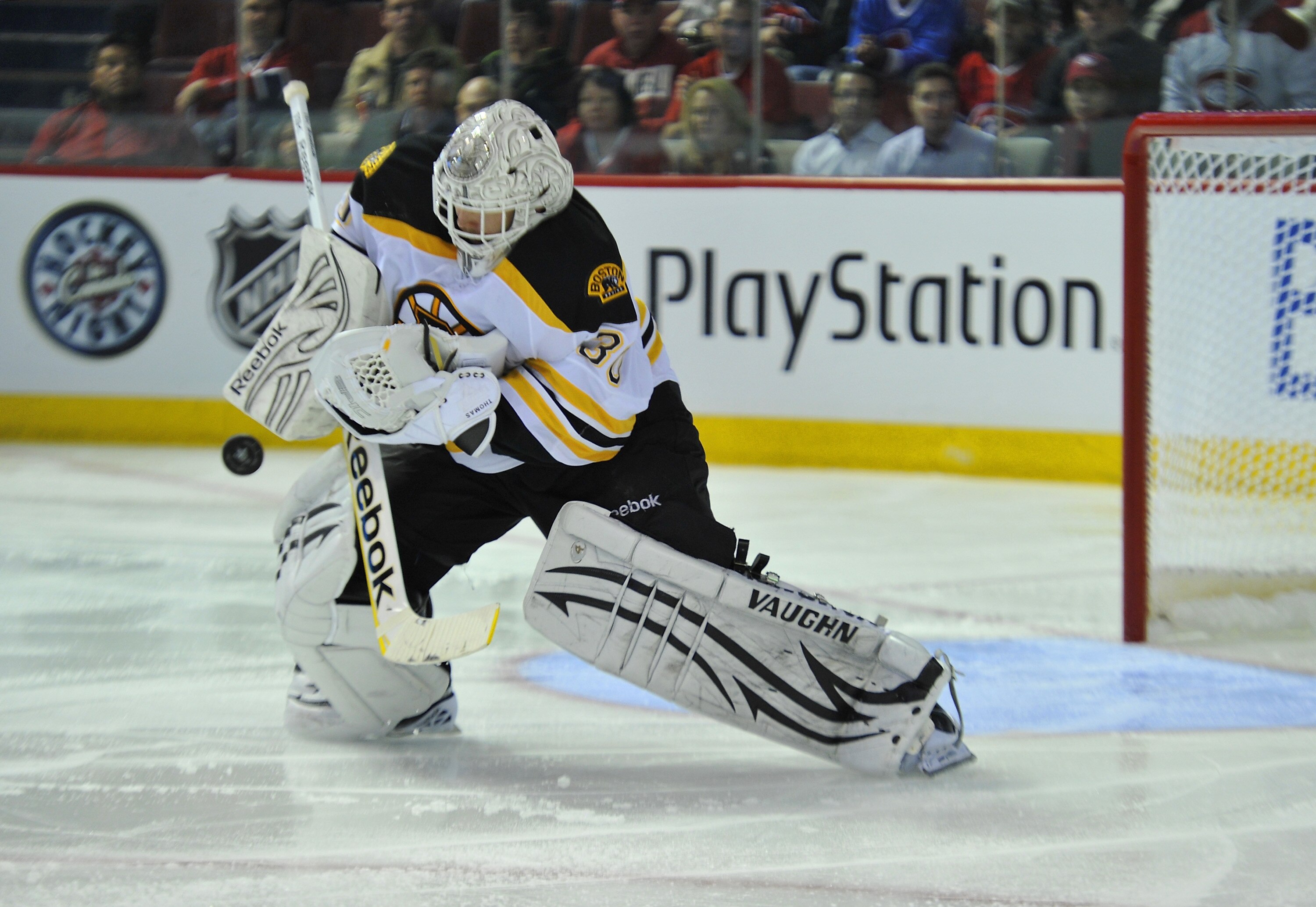 MONTREAL, CANADA - APRIL 18:  Tim Thomas #30 of the Boston Bruins makes a save against the Montreal Canadiens in Game Three of the Eastern Conference Quarterfinals during the 2011 NHL Stanley Cup Playoffs at the Bell Centre on April 18, 2011 in Montreal,