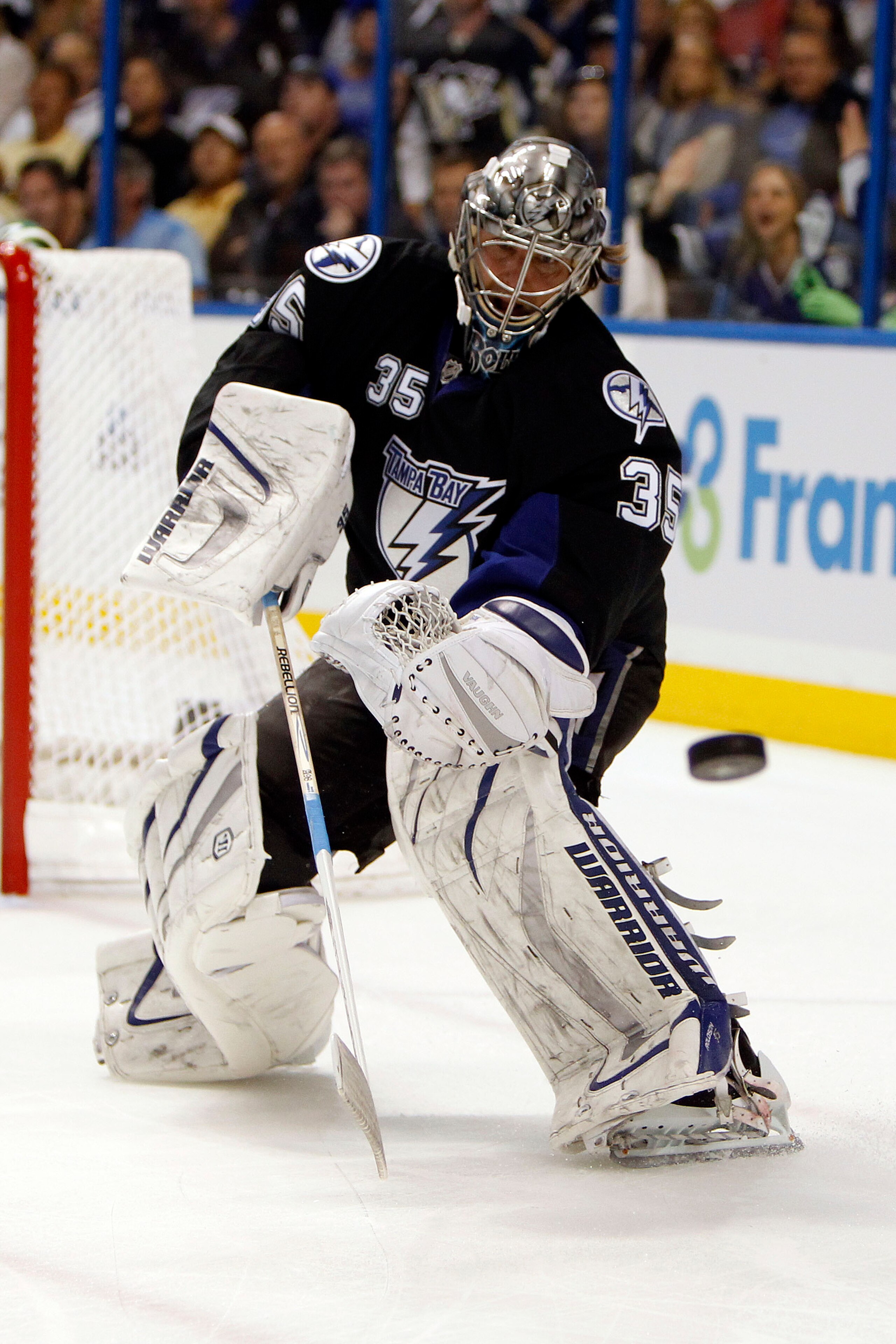 TAMPA, FL - APRIL 18: Goaltender Dwayne Roloson #35 of the Tampa Bay Lightning defends the net against the Pittsburgh Penguins in Game Three of the Eastern Conference Quarterfinals during the 2011 NHL Stanley Cup Playoffs at the St. Pete Times Forum on Ap
