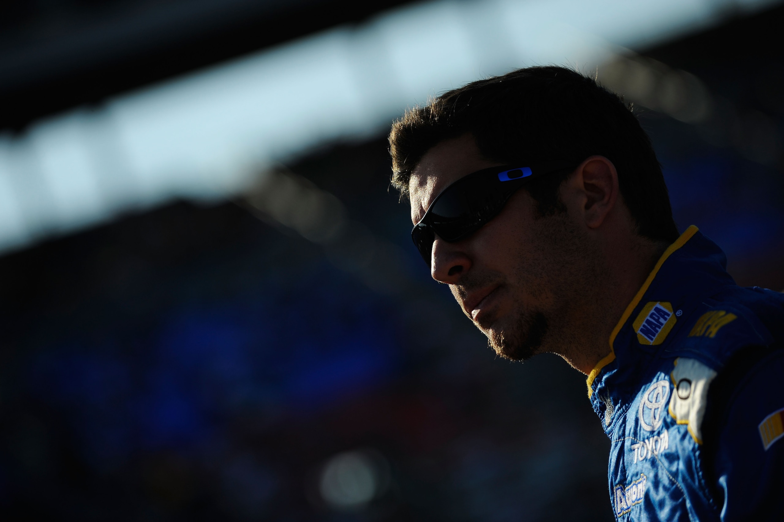 FORT WORTH, TX - APRIL 08:  Martin Truex Jr., driver of the #56 NAPA Auto Parts Toyota, walk on the grid during qualifying for the NASCAR Sprint Cup Series Samsung Mobile 500 at Texas Motor Speedway on April 8, 2011 in Fort Worth, Texas.  (Photo by Jared