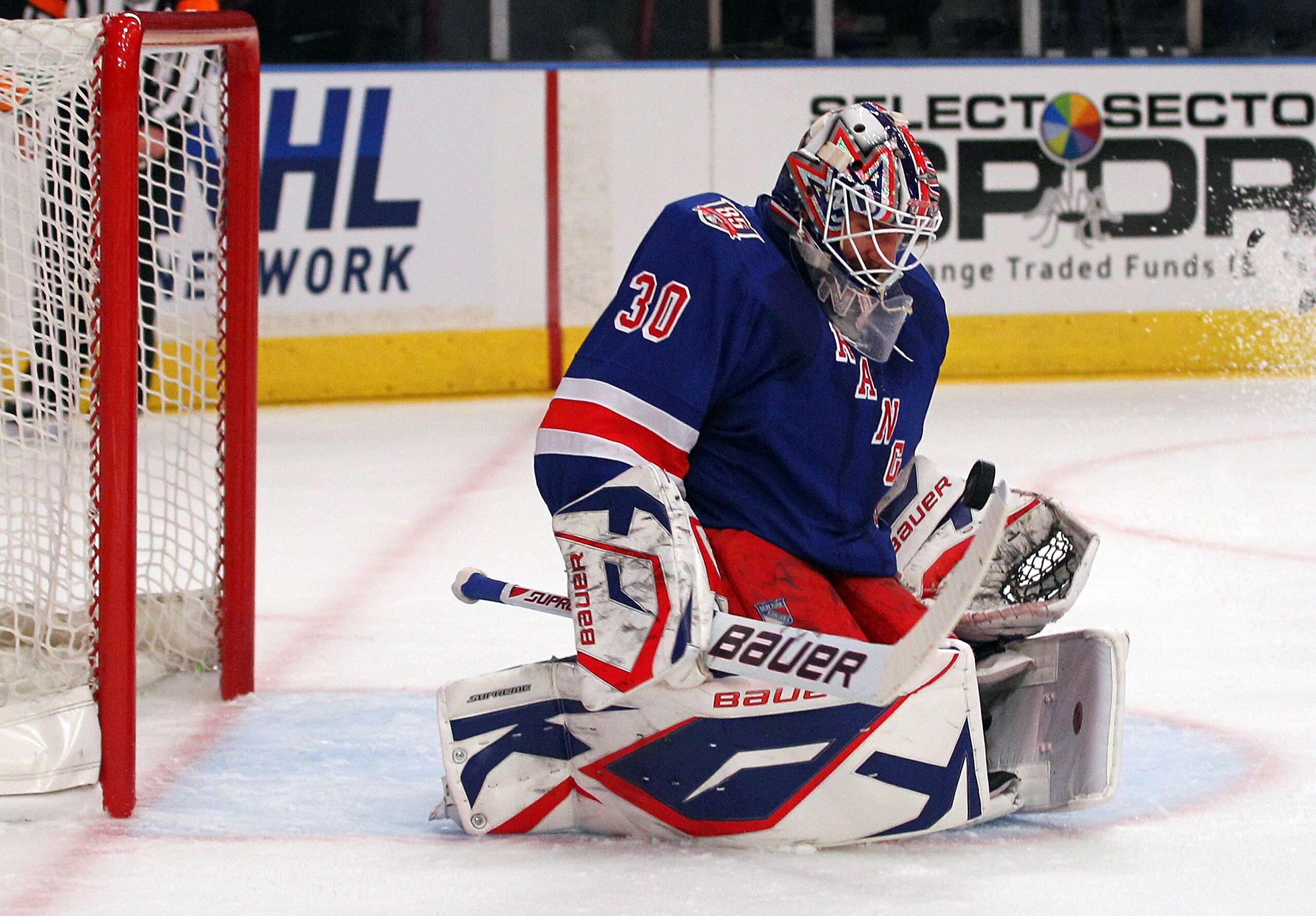 NEW YORK, NY - APRIL 17:  Goalie Henrik Lundqvist #30 of the New York Rangers makes a save against the Washington Capitals in the first period of Game Three of the Eastern Conference Quarterfinals during the 2011 NHL Stanley Cup Playoffs at Madison Square