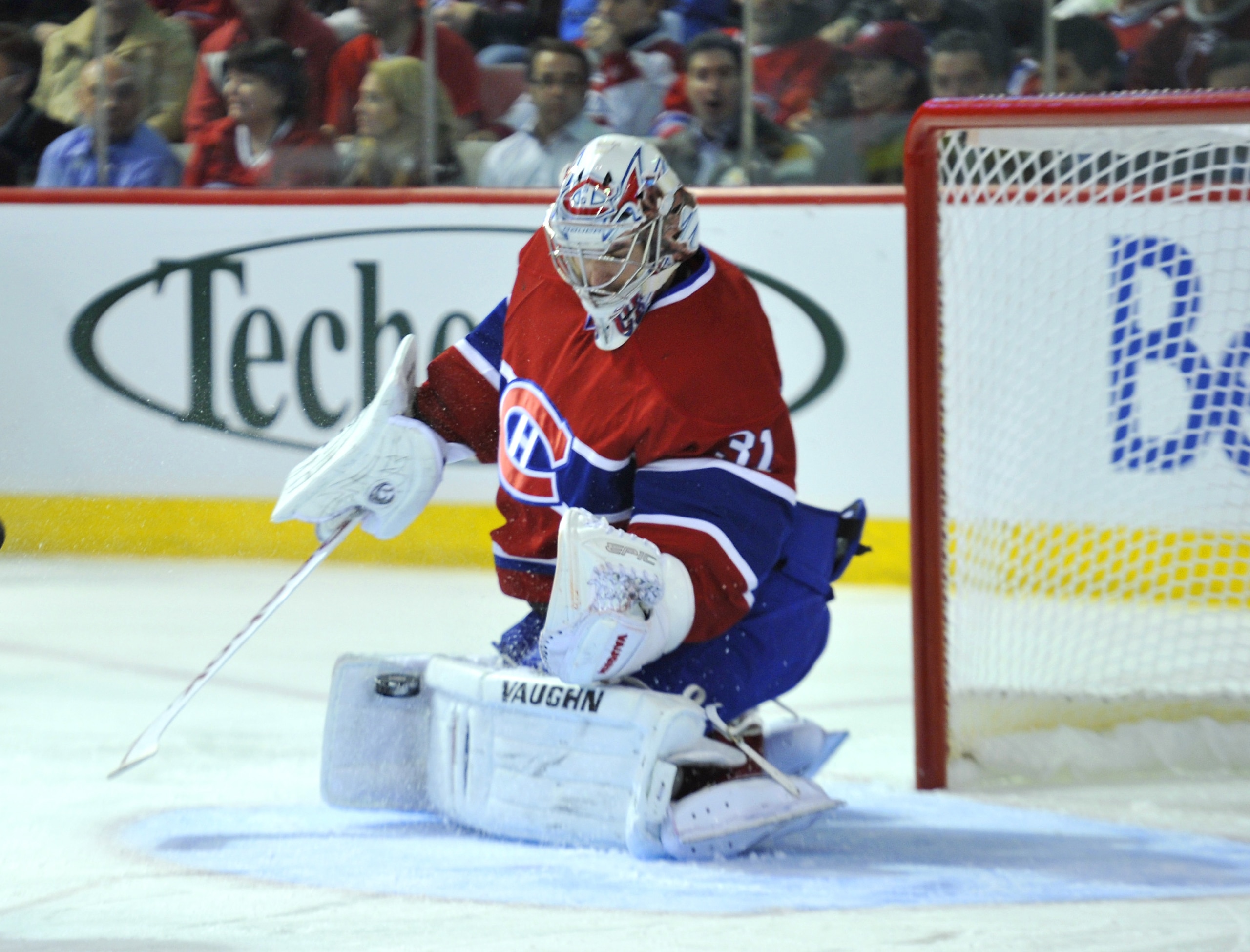 MONTREAL, CANADA - APRIL 18:  Carey Price #31 of the Montreal Canadiens makes a glove save against the Boston Bruins during Game Three of the Eastern Conference Quarterfinals during the 2011 NHL Stanley Cup Playoffs at the Bell Centre on April 18, 2011 in