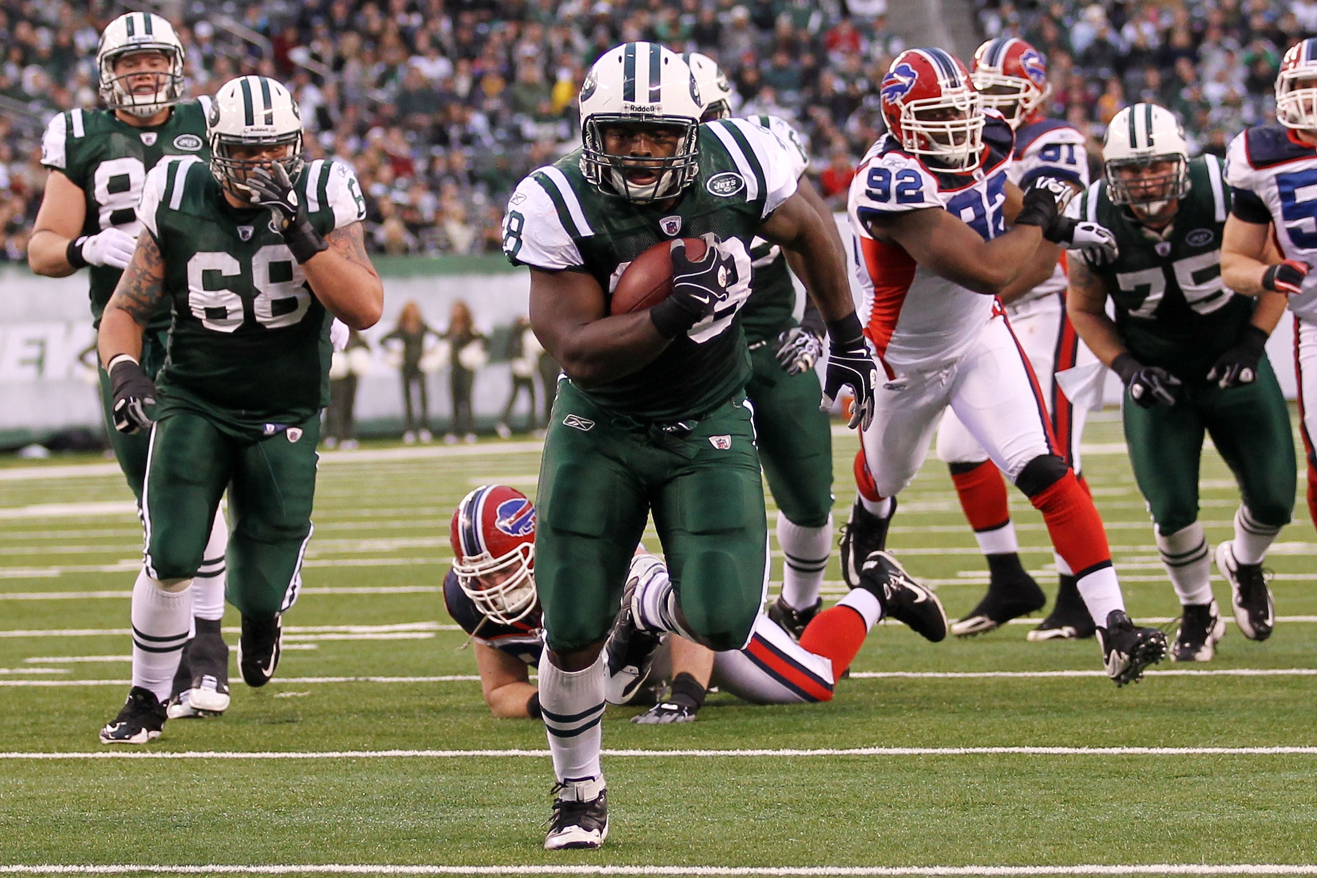 EAST RUTHERFORD, NJ - JANUARY 02:  John Conner #38 of the New York Jets runs for a touchdown against the Buffalo Bills at New Meadowlands Stadium on January 2, 2011 in East Rutherford, New Jersey.  (Photo by Al Bello/Getty Images)
