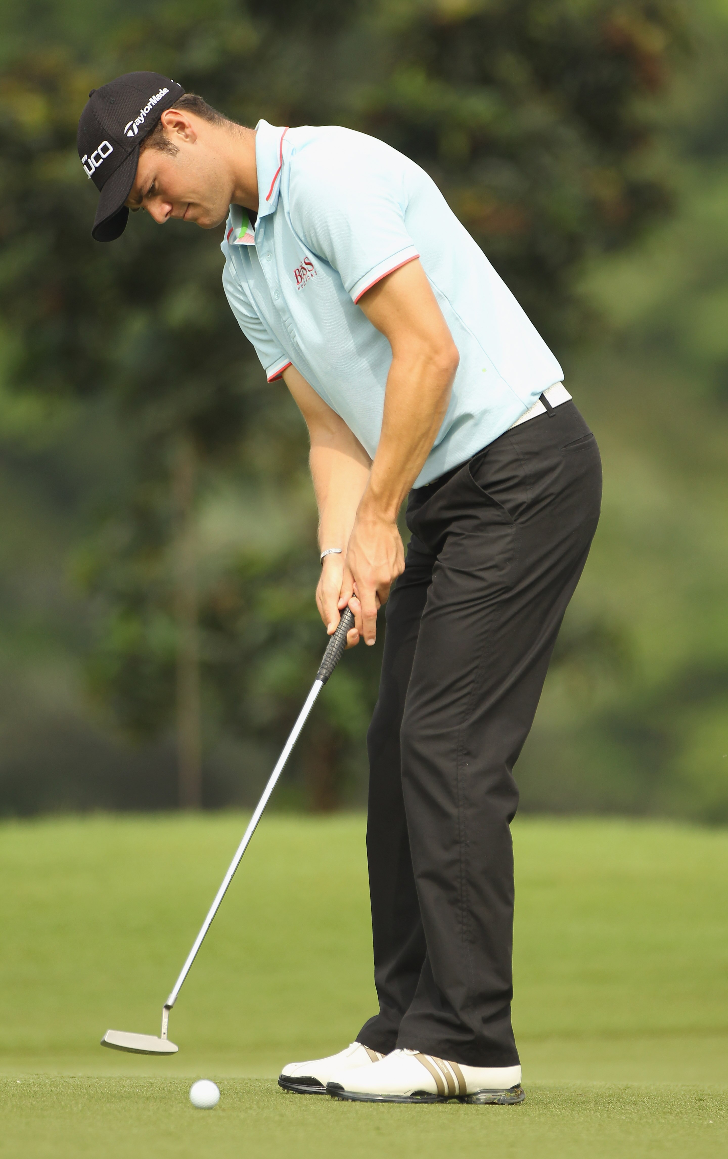 KUALA LUMPUR, MALAYSIA - APRIL 13:  Martin Kaymer of Germany putts during a practice round ahead of the Maybank Malaysian Open at Kuala Lumpur Golf & Country Club on April 13, 2011 in Kuala Lumpur, Malaysia.  (Photo by Ian Walton/Getty Images)