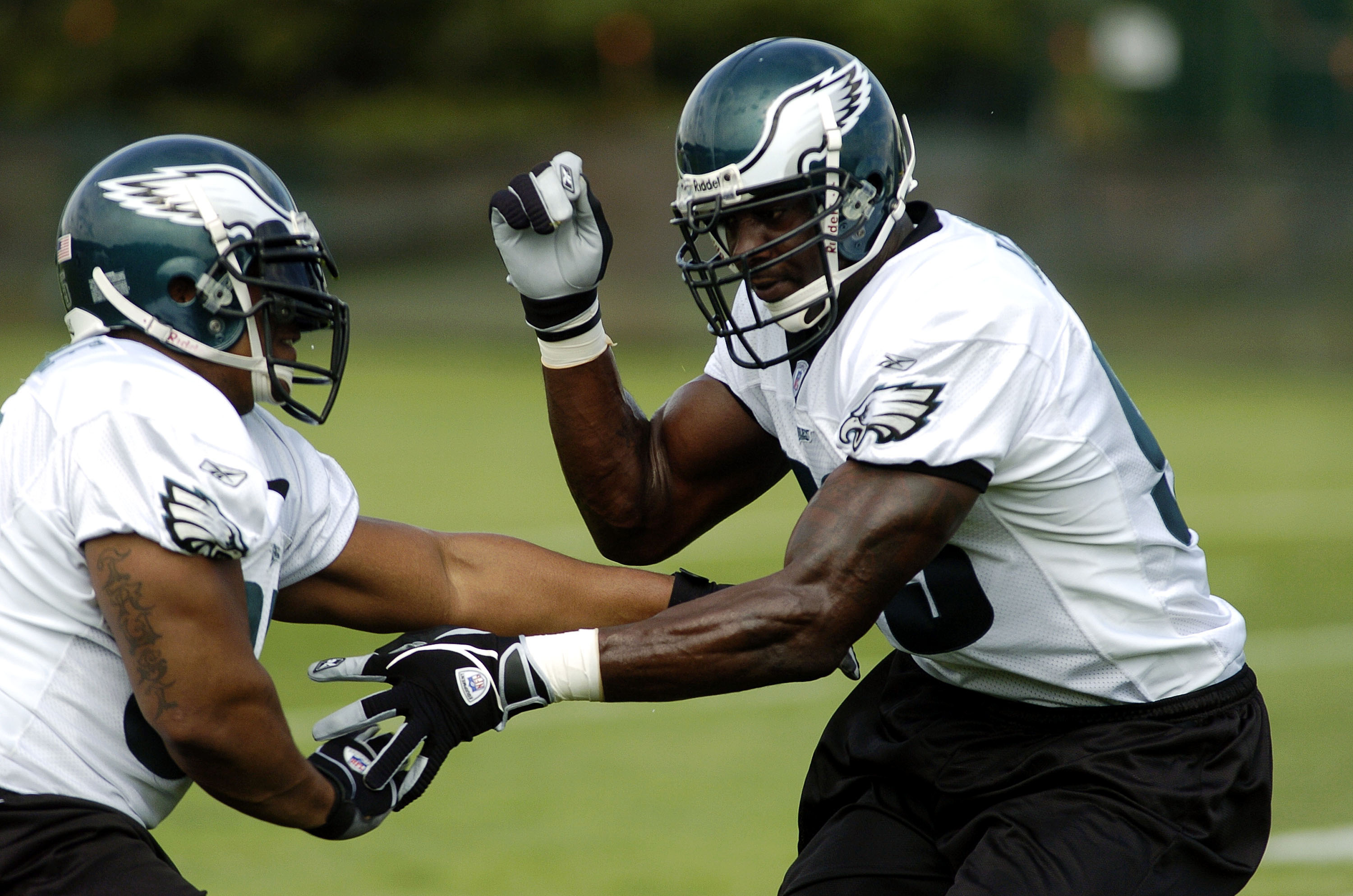 BETHLEHEM, PA - JULY 31:  Jevon Kearse #93 and Jerome McDougle #95 of the Philadelphia Eagles practice a blocking drill during training camp on July 31, 2004 at Lehigh University in Bethlehem, Pennsylvania.  (Photo by Greg Fiume/Getty Images)