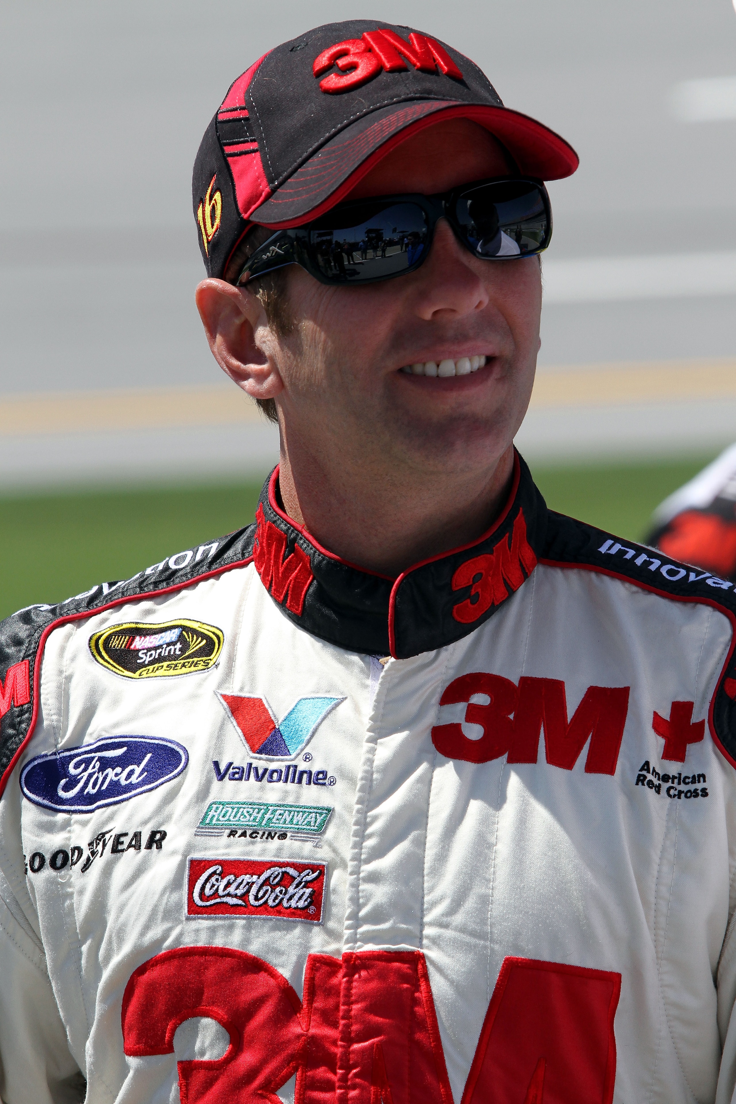 TALLADEGA, AL - APRIL 17:  Greg Biffle, driver of the #16 3M Scotch-Blue Painter's Tape Ford, stands on the grid prior to the NASCAR Sprint Cup Series Aaron's 499 at Talladega Superspeedway on April 17, 2011 in Talladega, Alabama.  (Photo by Jerry Marklan