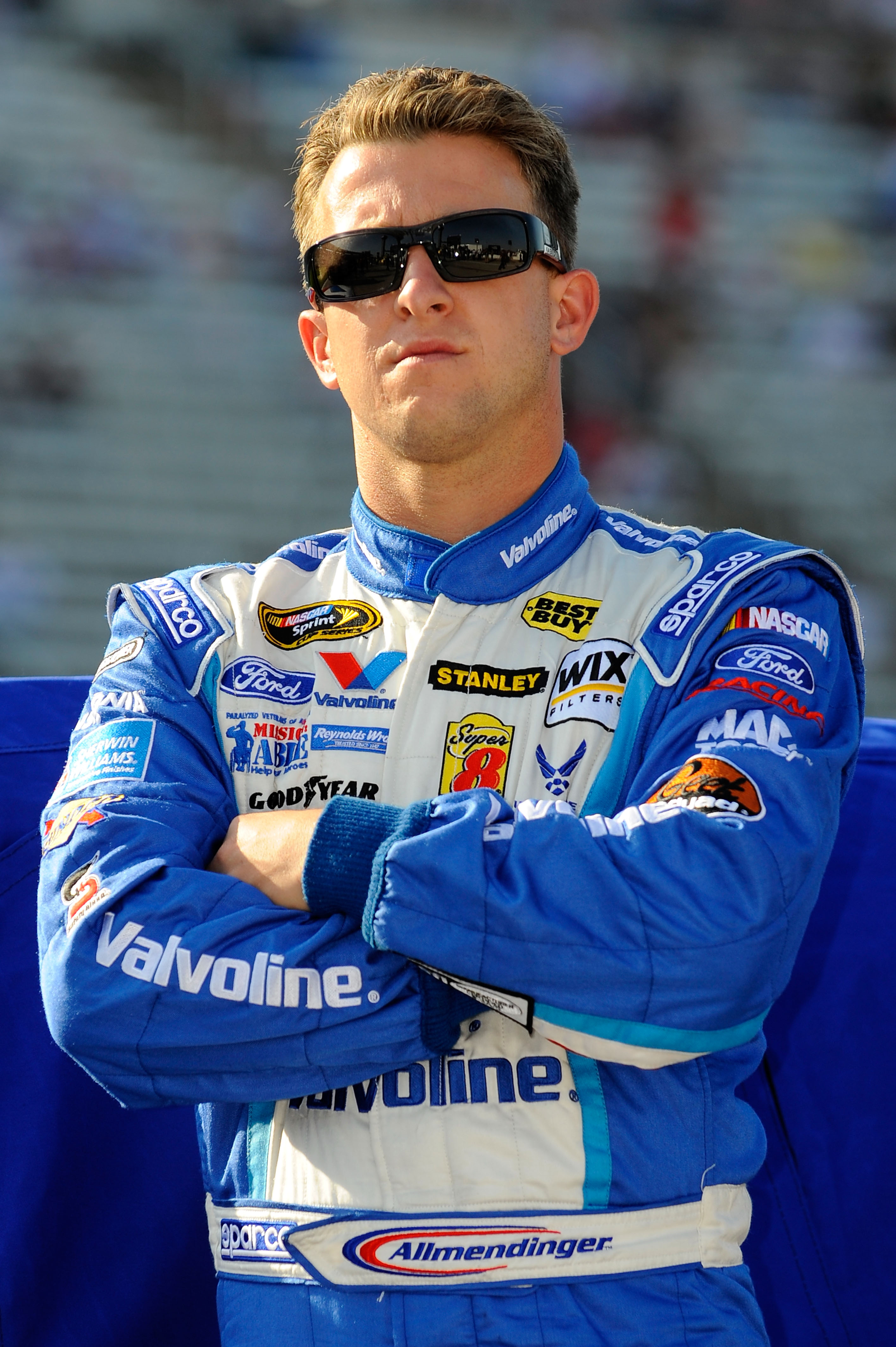 FORT WORTH, TX - APRIL 08:  A.J. Allmendinger, driver of the #43 Valvoline Ford, stands on the grid during qualifying for the NASCAR Sprint Cup Series Samsung Mobile 500 at Texas Motor Speedway on April 8, 2011 in Fort Worth, Texas.  (Photo by Jared C. Ti
