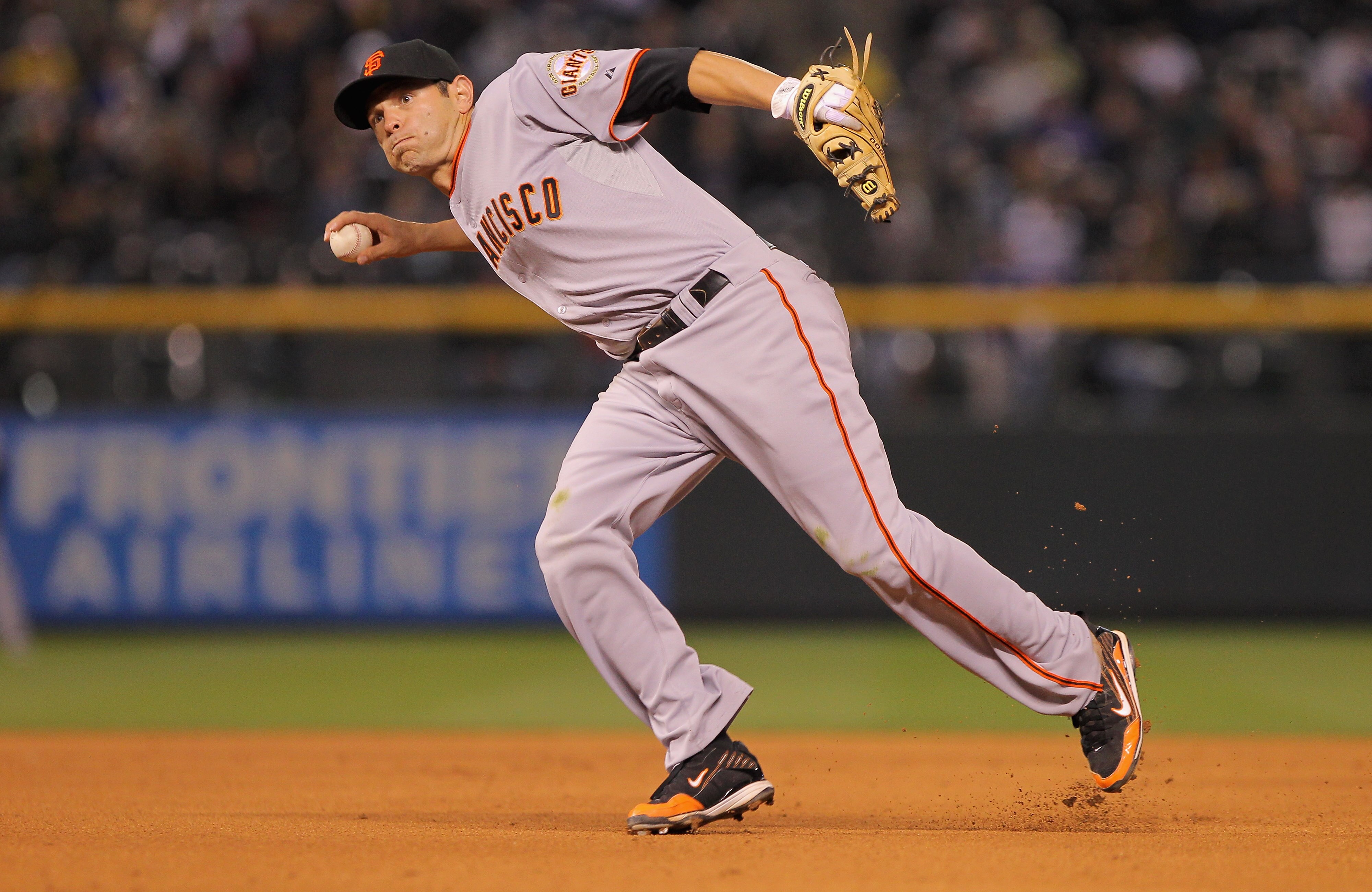 DENVER, CO - APRIL 18:  Second baseman Freddy Sanchez #21 of the San Francisco Giants throws out a runner against the Colorado Rockies at Coors Field on April 18, 2011 in Denver, Colorado.  (Photo by Doug Pensinger/Getty Images)