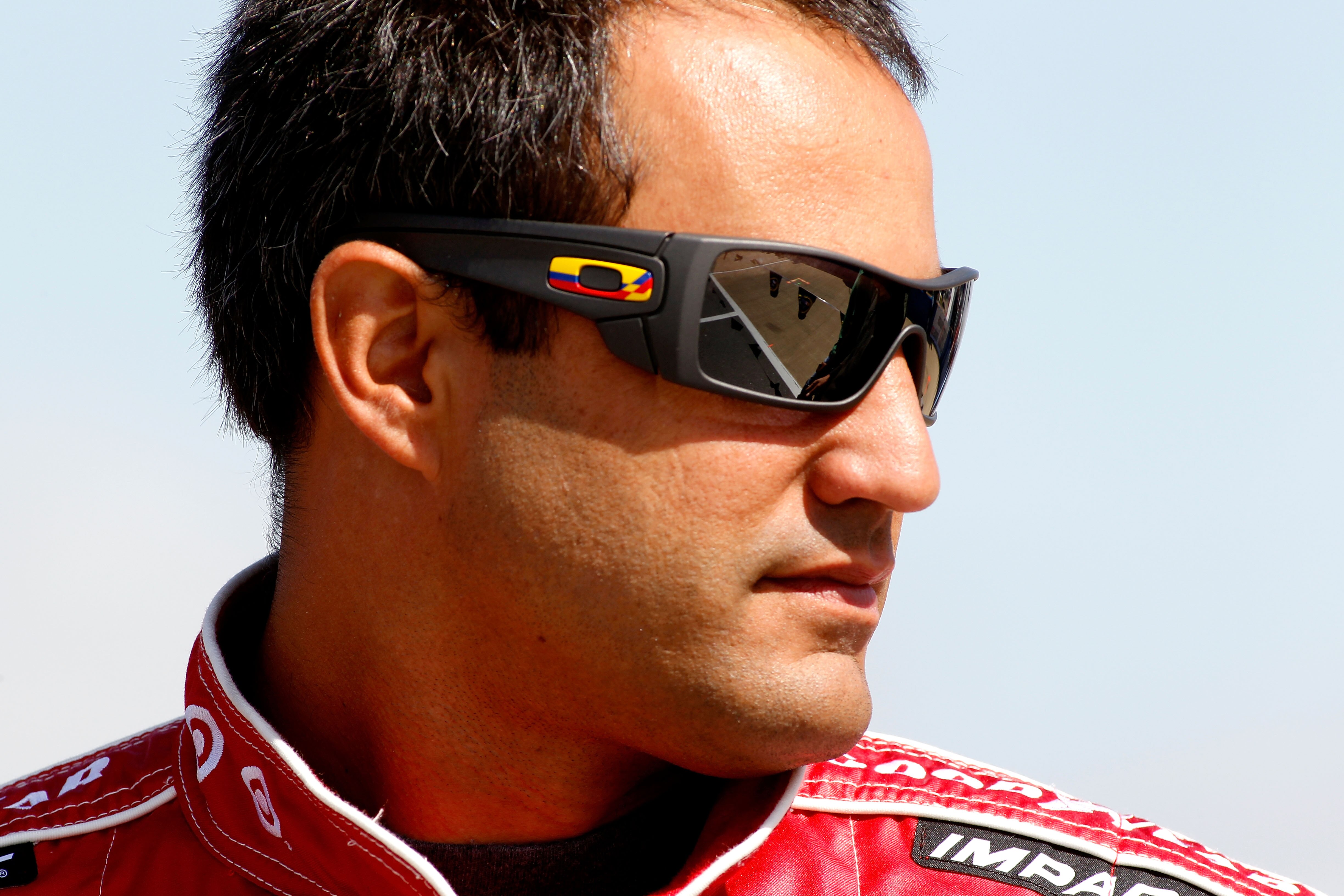 TALLADEGA, AL - APRIL 16:  Juan Pablo Montoya, driver of the #42 Target Chevrolet, stands on the grid during qualifying for the NASCAR Sprint Cup Series Aaron's 499 at Talladega Superspeedway on April 16, 2011 in Talladega, Alabama.  (Photo by Todd Warsha