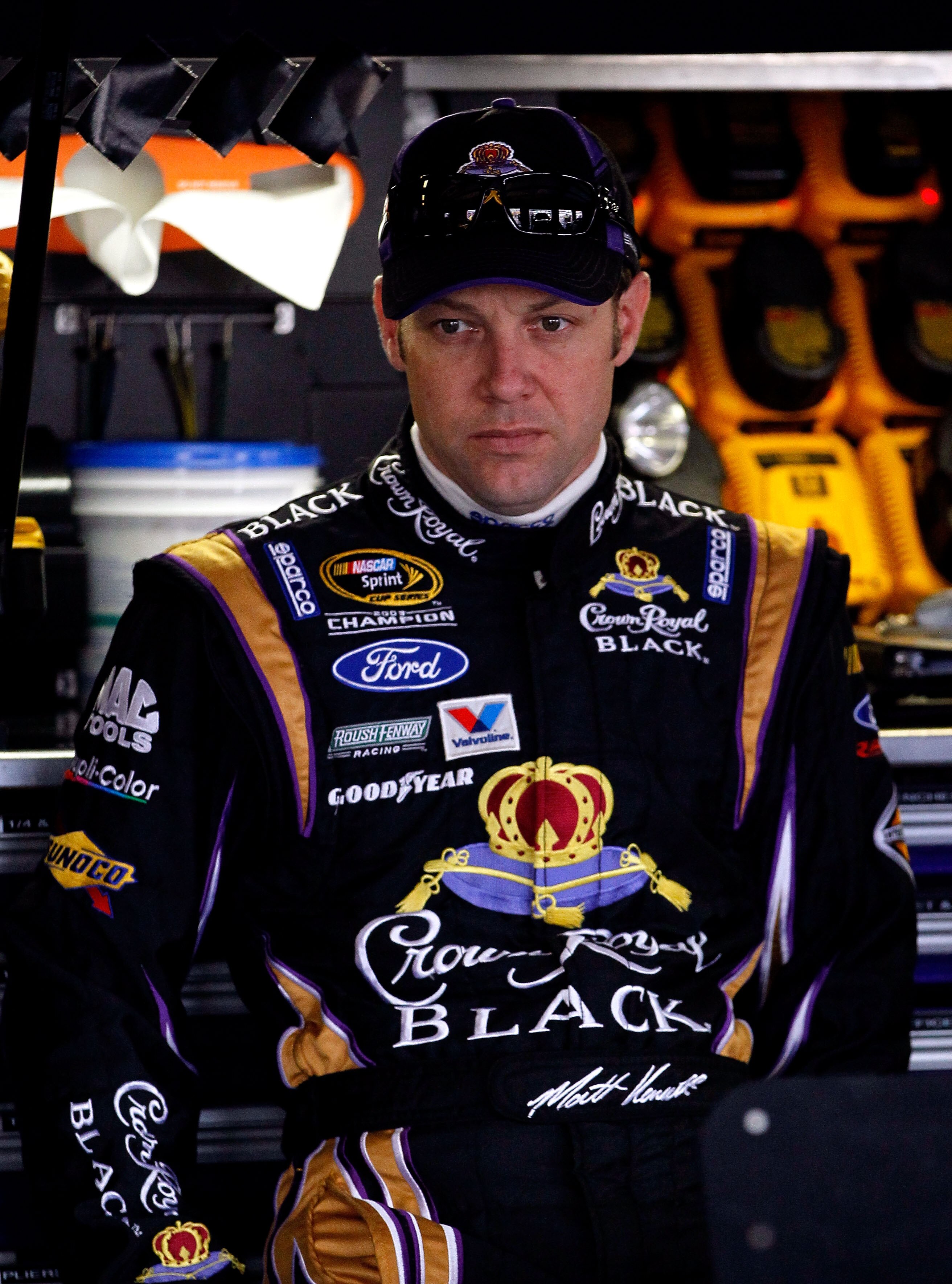 TALLADEGA, AL - APRIL 15:  Matt Kenseth, driver of the #17 Crown Royal Black Ford, stands in the garage during practice for the NASCAR Sprint Cup Series Aaron's 499 at Talladega Superspeedway on April 15, 2011 in Talladega, Alabama.  (Photo by Kevin C. Co