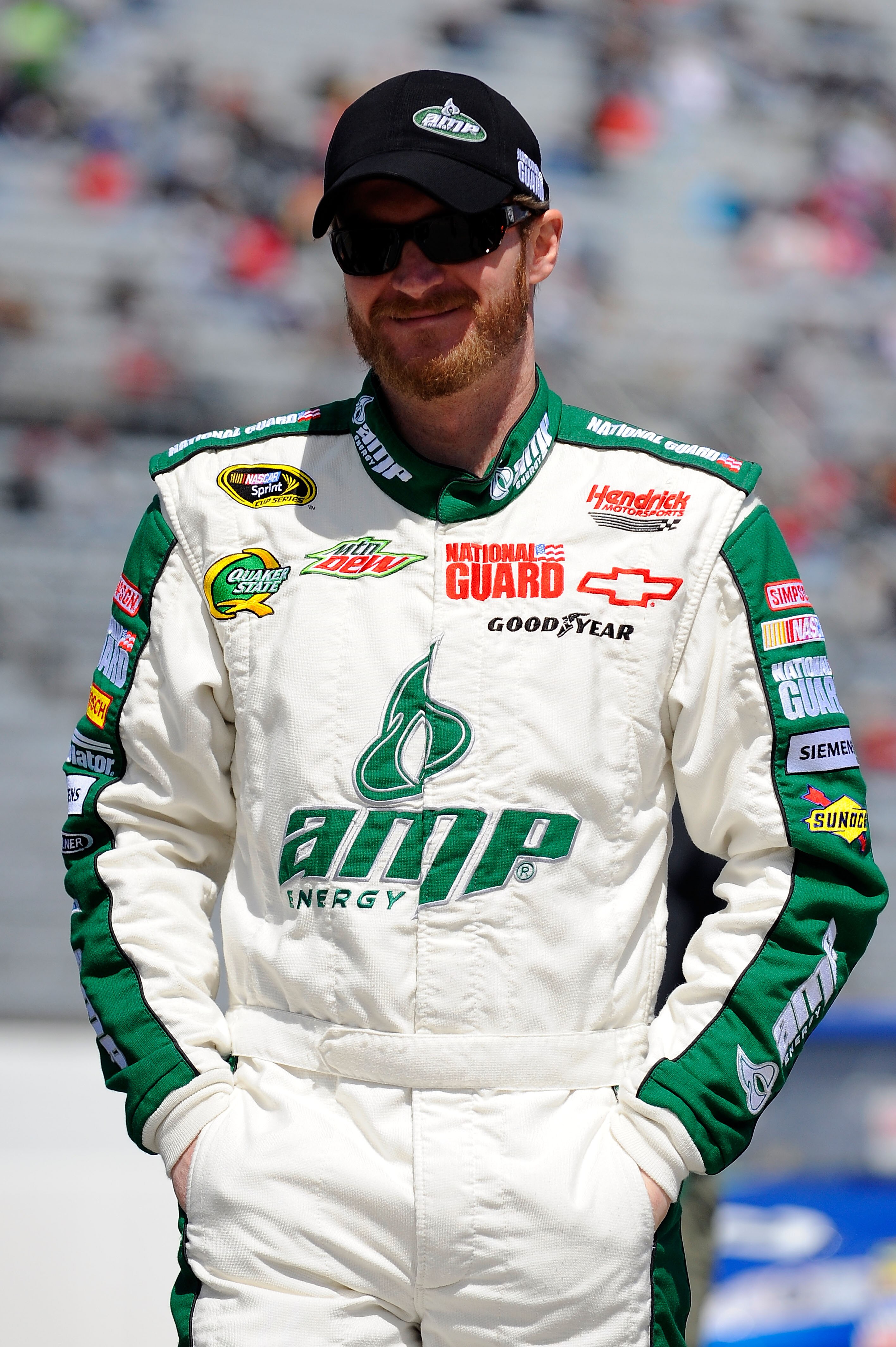 MARTINSVILLE, VA - APRIL 02:  Dale Earnhardt Jr., driver of the #88 Amp Energy/National Guard Chevrolet, walks on the grid during qualifying for the NASCAR Sprint Cup Series Goody's Fast Relief 500 at Martinsville Speedway on April 2, 2011 in Martinsville