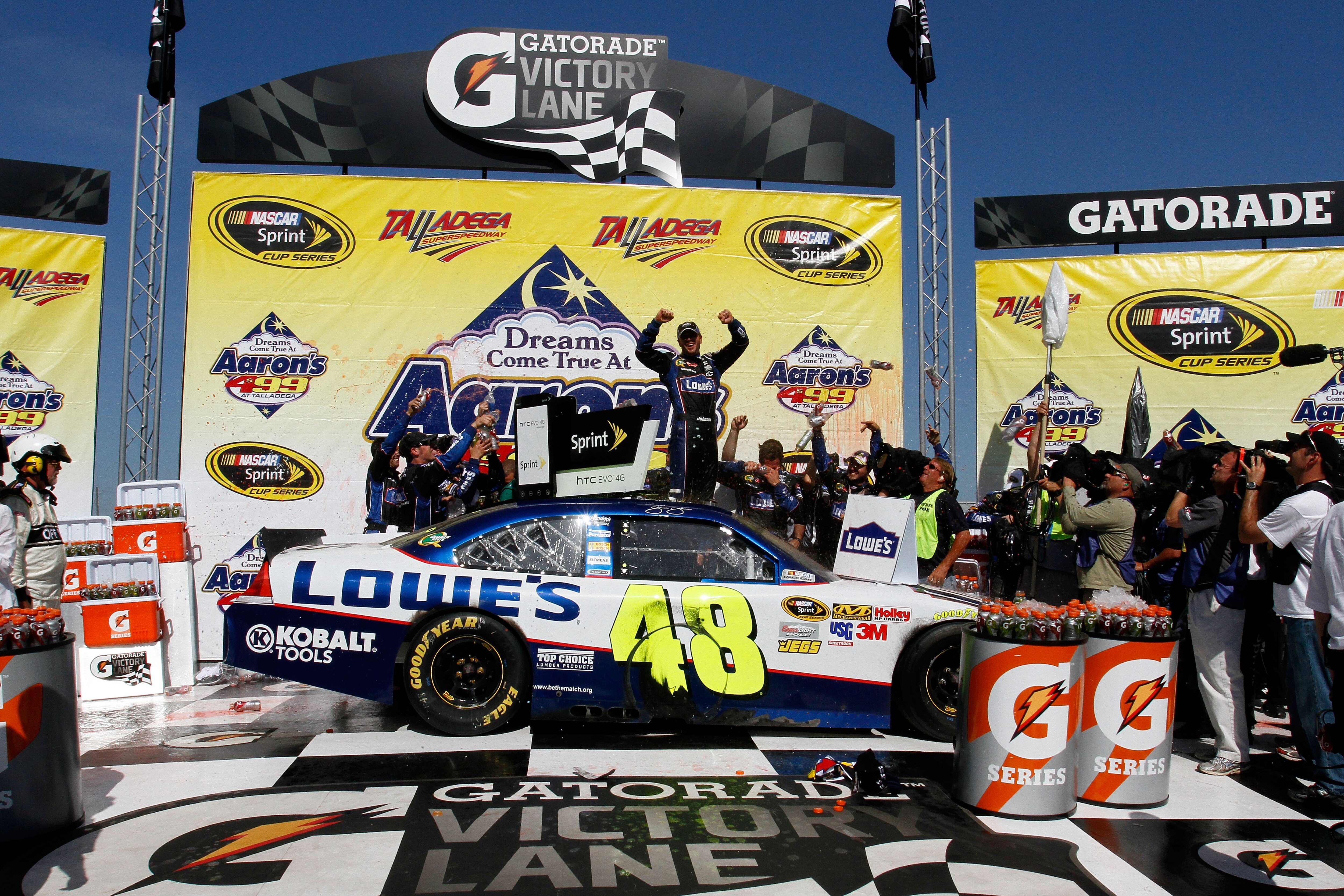 TALLADEGA, AL - APRIL 17:  Jimmie Johnson, driver of the #48 Lowe's Chevrolet, celebrates in Victory Lane after winning the NASCAR Sprint Cup Series Aaron's 499 at Talladega Superspeedway on April 17, 2011 in Talladega, Alabama.  (Photo by Jason Smith/Get