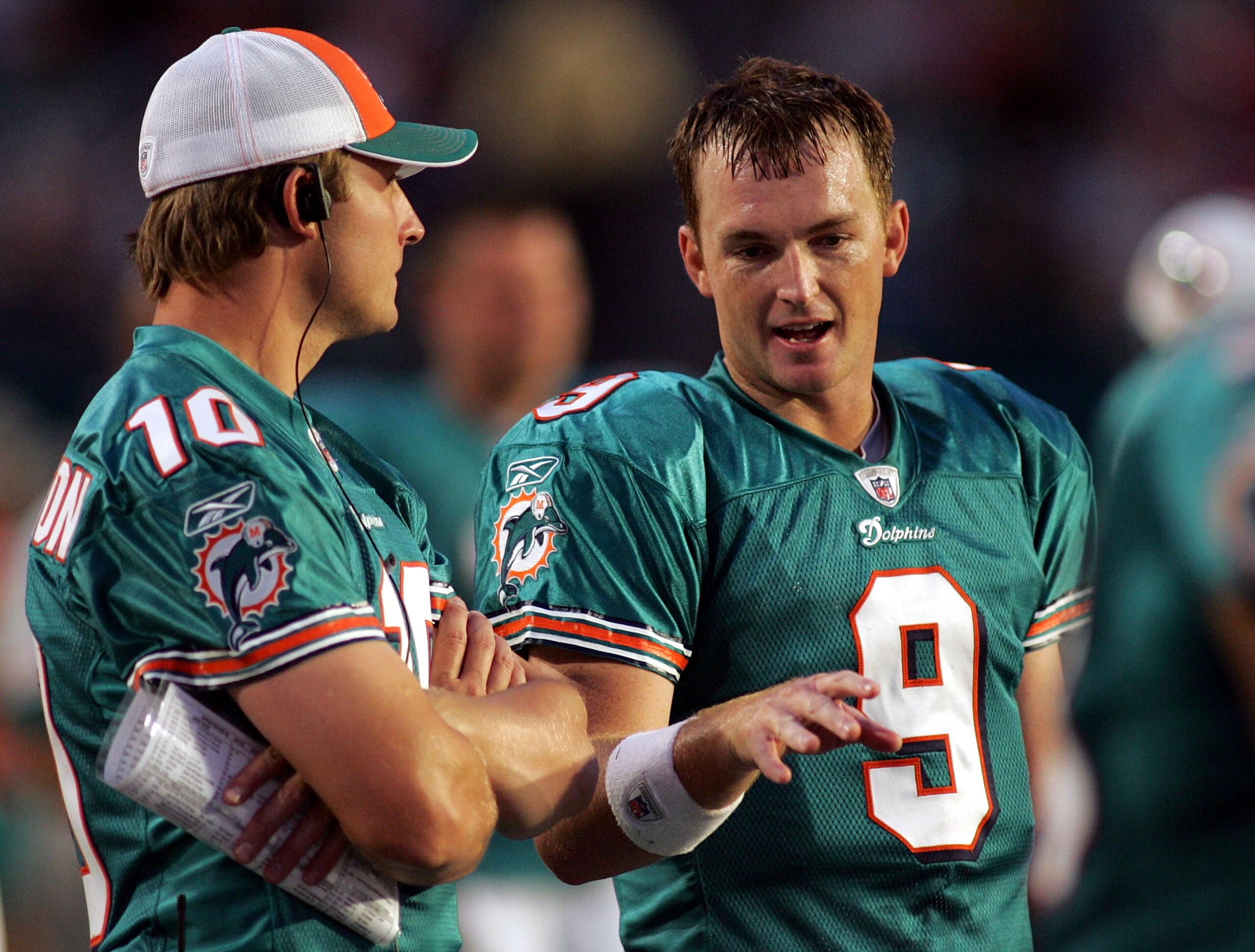 MIAMI - AUGUST 09:  Quarterback Chad Pennington #10 of the Miami Dolphins chats with quarterback John Beck #9 during a pre season game against the Tampa Bay Buccaneers August 9, 2008 at Dolphin Stadium in Miami, Florida.  (Photo by Marc Serota/Getty Image