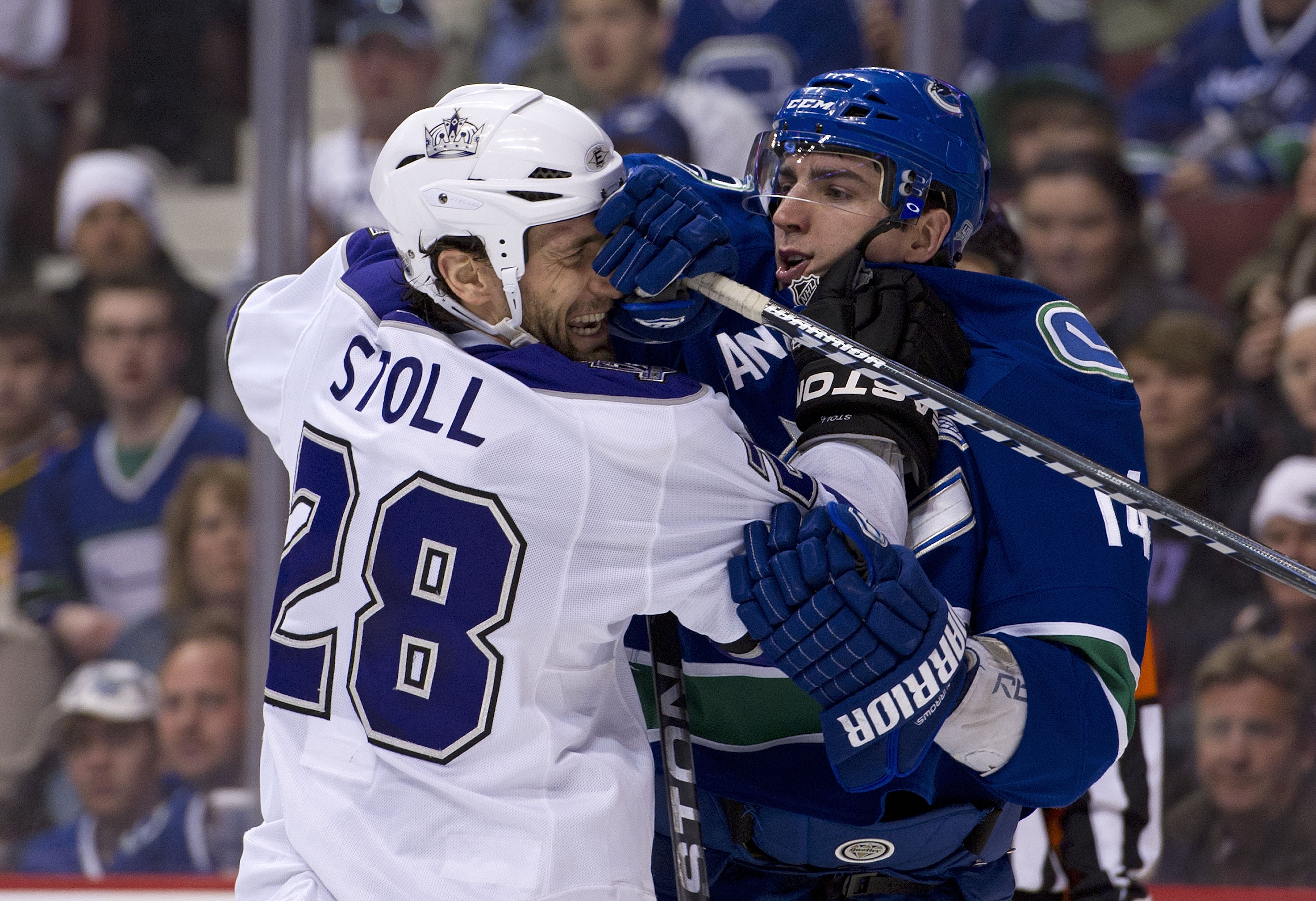 VANCOUVER, CANADA - MARCH 31: Alexandre Burrows #14 of the Vancouver Canucks and Jarret Stoll #28 of the Los Angeles Kings push and shove after the whistle during the second period in NHL action on March 31, 2011 at Rogers Arena in Vancouver, BC, Canada. VANCOUVER, CANADA - MARCH 31: Alexandre Burrows #14 of the Vancouver Canucks and Jarret Stoll #28 of the Los Angeles Kings push and shove after the whistle during the second period in NHL action on March 31, 2011 at Rogers Arena in Vancouver, BC, Canada.