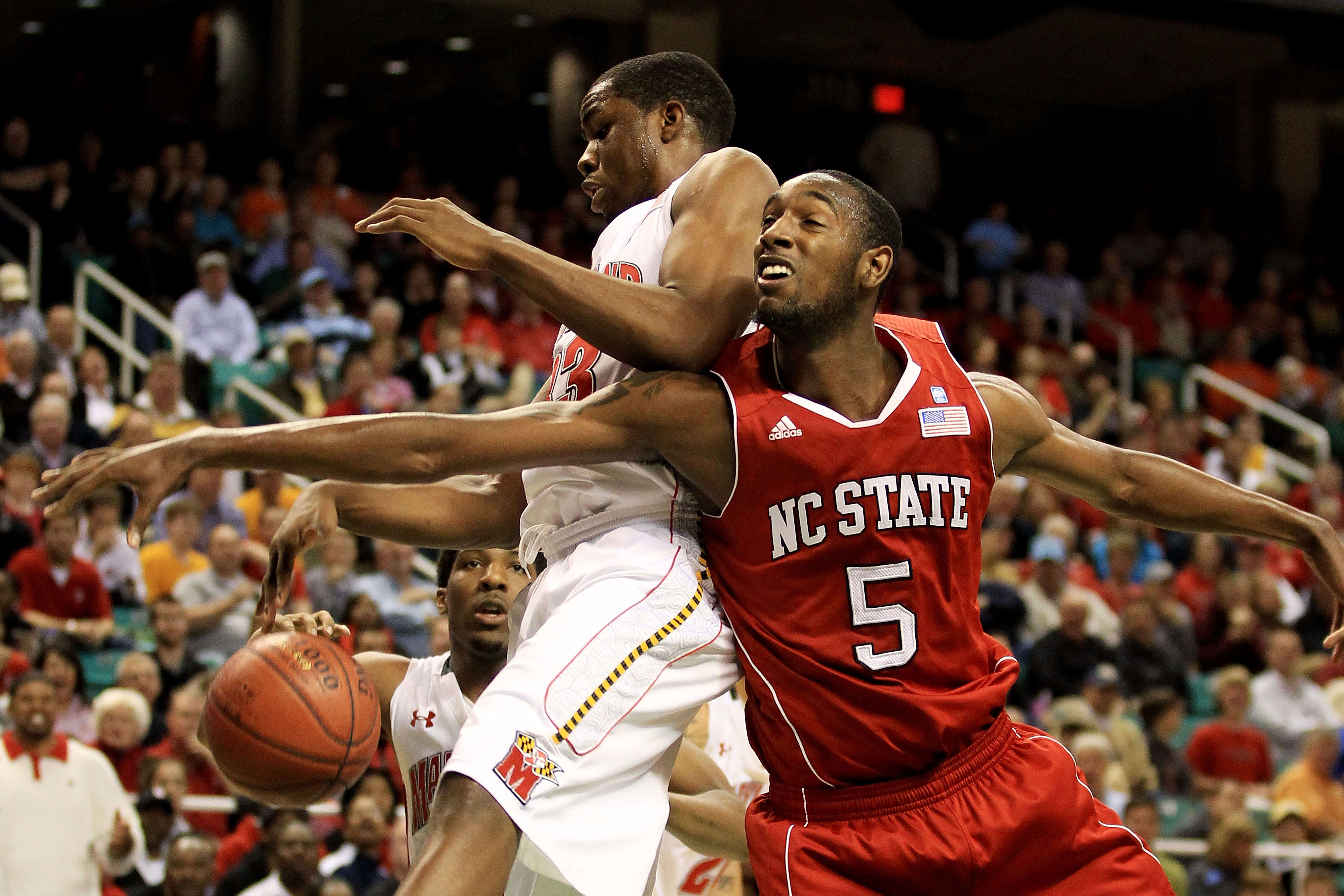 GREENSBORO, NC - MARCH 10:  Dino Gregory #33 of the Maryland Terrapins blocks a shot by C.J. Leslie #5 of the North Carolina State Wolfpack during the second half of the game in the first round of the 2011 ACC men's basketball tournament at the Greensboro